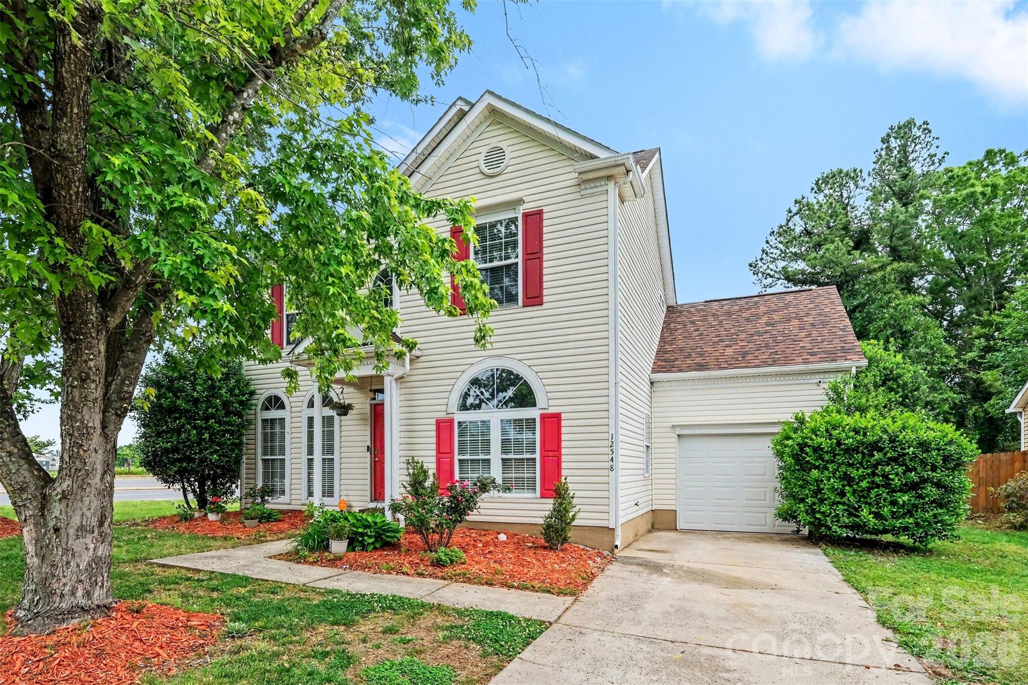 LOWER YOUR PAYMENTS! SELLER IS OFFERING TO PAY TOWARD A RATE BUY-DOWN! CALL FOR MORE INFO! Great corner lot central to Prosperity Village, UNC, Uptown, Concord and more! Refreshed and ready for new owners, this 3 bedroom 2.5 bath home has all the great updates you want, the space you need and more! With aprx 3 yr old windows, roof and siding; all new lighting, switches, outlets, flooring, and paint throughout, this home is ready to go! Your primary bedroom is on the main level with new LVP floors and a stunning ensuite bathroom with walk-in tile shower. Two large secondary bedrooms and a loft upstairs with new carpet and another completely remodeled full bathroom. Fenced back yard with mature, low-maintenance landscaping on a large corner lot, alarm system with cameras, this home is truly move-in ready. Easy access to 485, shopping, dining, University Research Park, UNC, makes the location just as great as the house! Enjoy the character of this home, with all the new updates and low maintenance living for years to come!