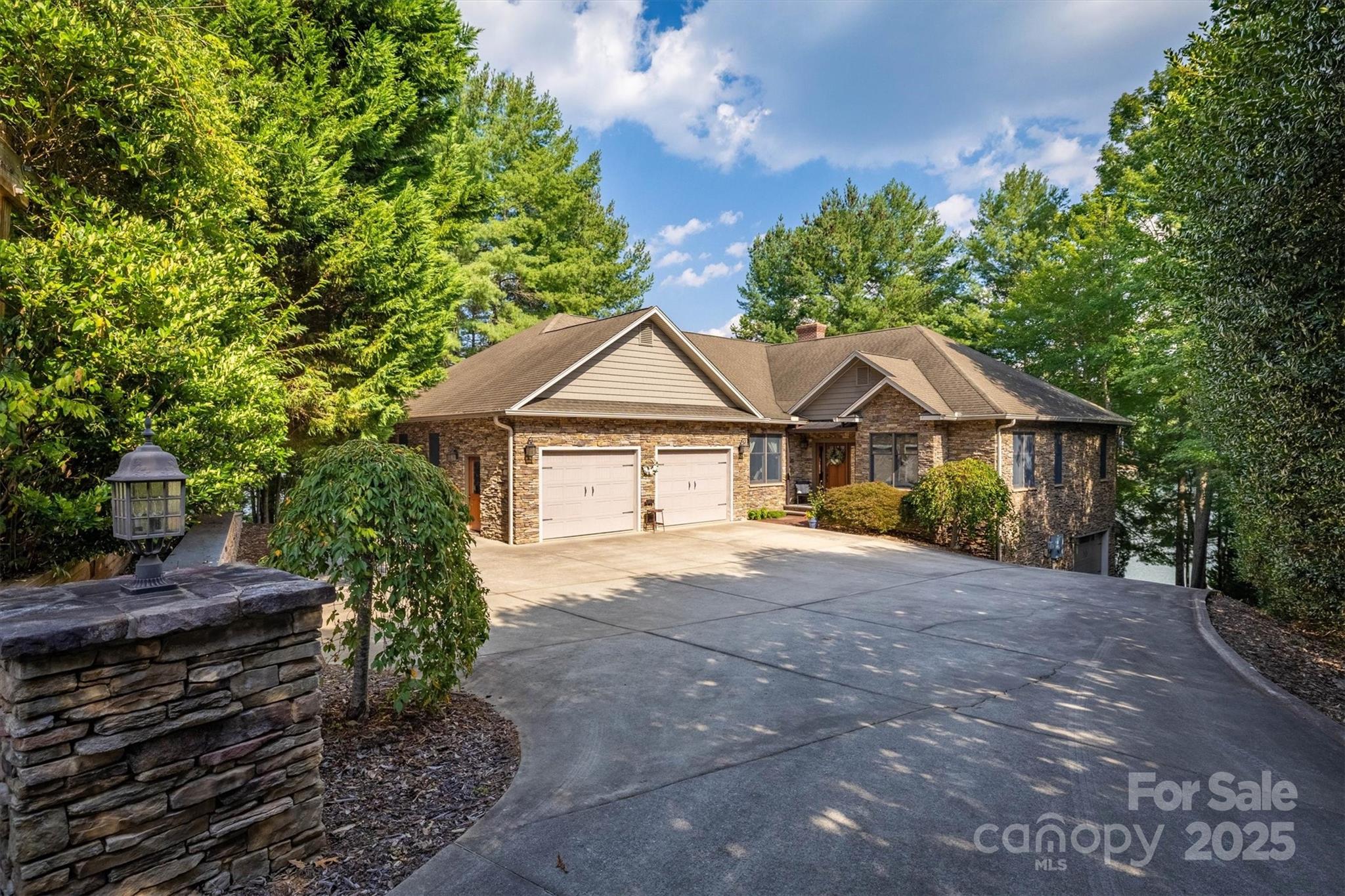 Custom lakefront home on Lake James. Located in the highly sought-after SouthPointe neighborhood in Morganton, NC. This builder's own custom home was thoughtfully designed and built to maximize water views, lake access, and entertaining space.  This property offers one of the rarest features on the lake, a gently sloping walkable approach to the shoreline and dock, on the main channel. Amazing outdoor entertaining features include not just one 16'x36' covered cedar porch overlooking the lake from above, but also another 16'x36' bluestone patio with a large wood-burning fireplace, plus an outdoor shower with a private changing area. 
The main level features two bedrooms with en-suites, two home offices for work or study spaces, both of which have closets and could be used as bedrooms. The living room features a beautiful wood-burning stone fireplace to relax by. Both levels have full kitchens, two bedrooms, and dining areas inside or out. Take a walk down to the private over-the-water gazebo and dock, which were replaced in 2025; the dock has two slips, one of which has a boat lift. on a .59-acre lot with approximately 275 ft of waterfront. Plenty of parking outside and in, the home has two garages, with a total of 5 bays. 2 on grade and 3 more under. 
With its variety of outdoor living spaces, this home provides numerous opportunities to enjoy lake life. whether relaxing on the cedar porch, gathering around the fireplace on the bluestone patio, or entertaining on the water's edge in the gazebo. Designed for comfort and connection, it's a home that's ideal for large or private gatherings and year-round enjoyment. The owner wishes to take all calls personally. Please call the owner to set up all showings.