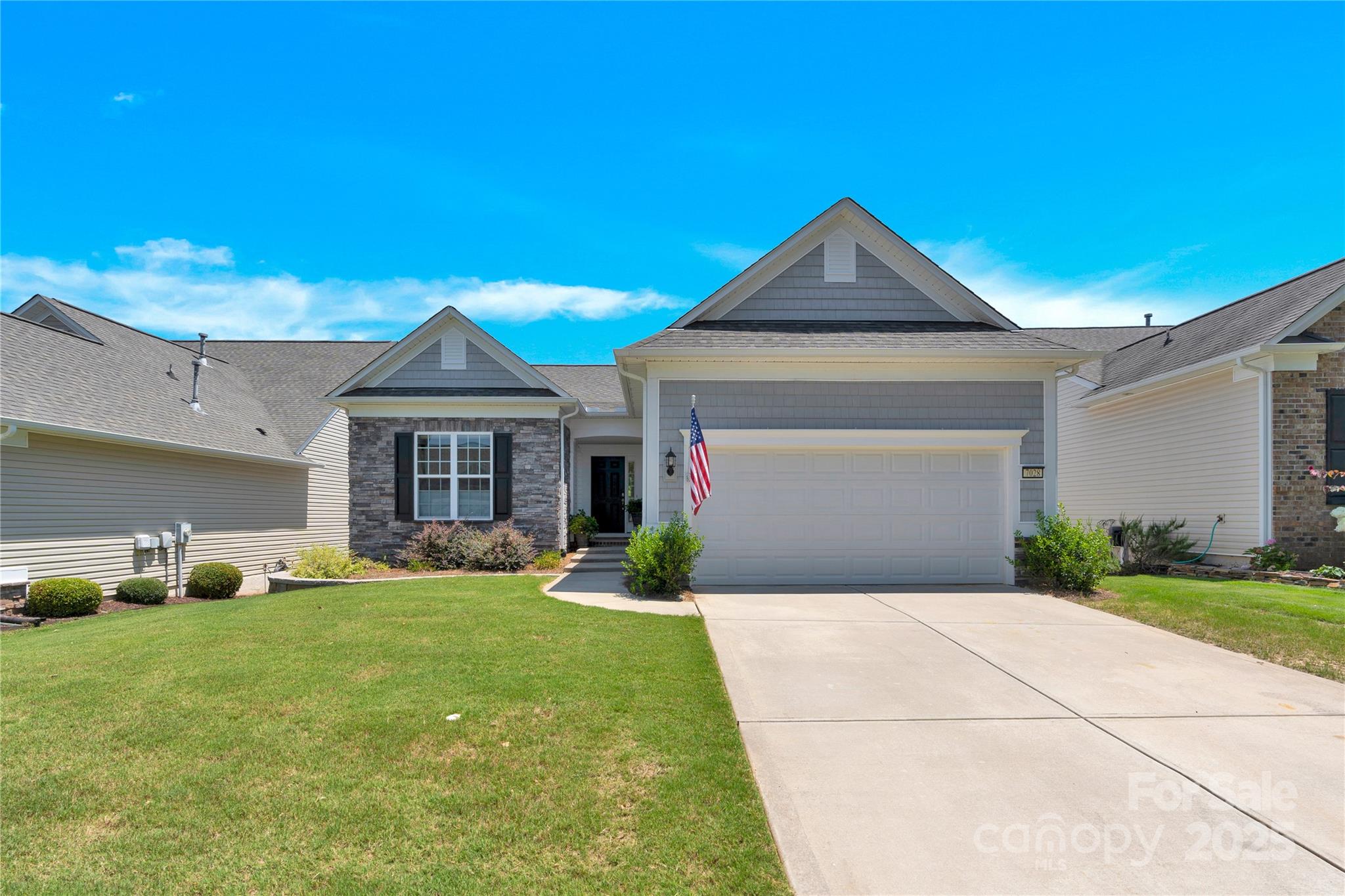 Immaculate Copper Ridge basement home is move-in ready! Main floor has a separate office; Guest bedroom with/ adjacent Full Bath. Kitchen - granite countertops, tile backsplash, SS appliances, and under-cabinet lighting. The eat-in breakfast bar connects to the Dining area and flows to the Sun Room and deck, complete w/gas grill connection. The primary bedroom features a tray ceiling and an en-suite bath that includes a standalone shower, double vanities, and a spacious walk-in closet. Downstairs, the fully finished walk-out basement offers versatility. A large Flex room provides endless possibilities, such as a media room, exercise space, or hobby area. The third bedroom suite with a sitting area is perfect for family or guests. Unfinished storage area includes a shop with a workbench/pegboard, and it's heated/cooled. The extended covered paver patio offers a private space for outdoor living. Enjoy the resort-style amenities of Sun City Carolina Lakes.
