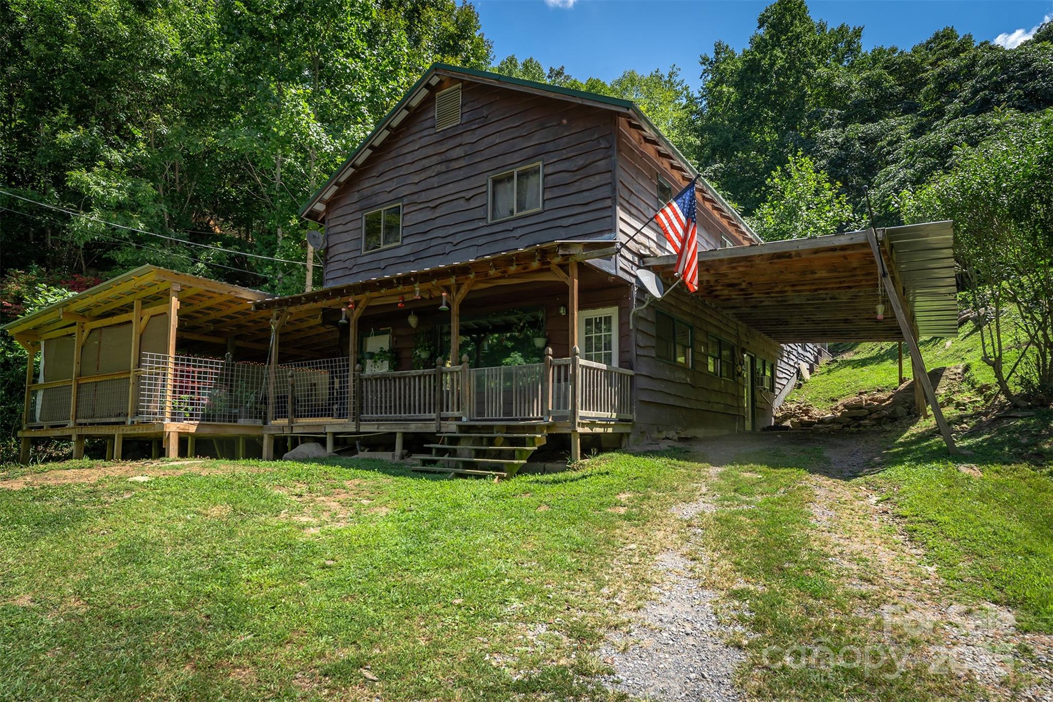 Nestled deep in The Blue Ridge Mountains, this rustic cabin offers an opportunity for mountain living and lifestyle. The property has 15 acres of open-use mountain land, providing space for gardening, livestock, and outdoor recreation.

This home features four bedrooms, two bathrooms, addition bonus room. Enjoy the covered front and side porch. The home has newer appliances, tankless hot water heater and propane heat. The property is complete with a barn, a chicken coop, and a large metal shed for all your storage needs. Don't worry about staying connected; this home has high-speed fiber optic internet.

Surrounded by National Forest, this home is a true nature haven. Experience the "JEWEL" of the Blue Ridge Mountains" and embrace mountain living in the Spring Creek community.