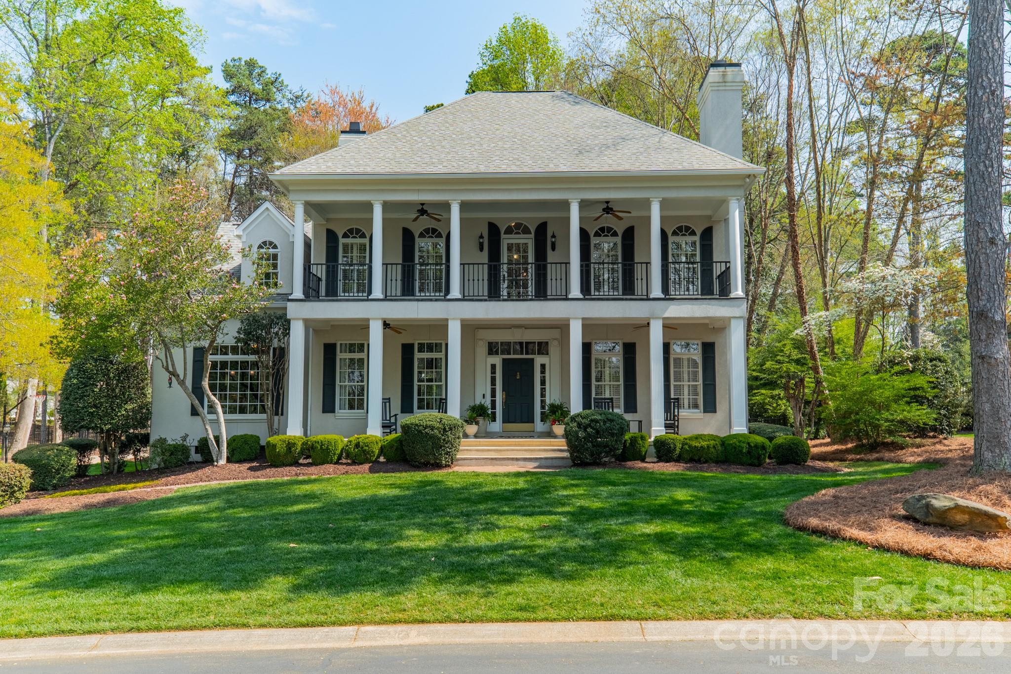 Welcome to 126 Patience Place Lane in the desirable Donaldson Landing neighborhood. This beautifully updated two-story home offers classic charm and generous space with stunning lake views dircetly across the street. Perfectly situated on a private cul-de-sac, this home features distinctive double front porches that create a welcoming Southern-style facade and the perfect place to relax while enjoying the water views.
Inside, the home has been thoughtfully refreshed with newly refinished hardwood floors and brand new carpet, along with updated tile work in the upstairs bathrooms and a newly refinished Primary bath. The Primary bedroom suite is conveniently located on the first floor, provideing privacy and ease of living.
The renovated kitchen showcases granite countertops, a stylish glass tile backsplash and ample workspace, and opens to a cozy keeping room that could be used as a coffee retreat or dinette area.
Also, on the main level is a private office with fireplace offering an ideal work-from-home setting or quiet retreat.
Upstairs, you will find four additional bedrooms, offering plenty of room for family and guests. A spacious bonus room with walk-in storage provides space for a media room, playroom, home office or gym.
There is an oversized 2 car garage that opens to the laundry room, both areas with outside access. 
The backyard is fenced with a newly poured patio, perfect for outdoor gatherings and BBQ's.
This home combines comfort, space, and lake lifestyle living in a highly desirable setting. The deeded boatslip, with lift, is just a short walk from the property for easy lake access.
