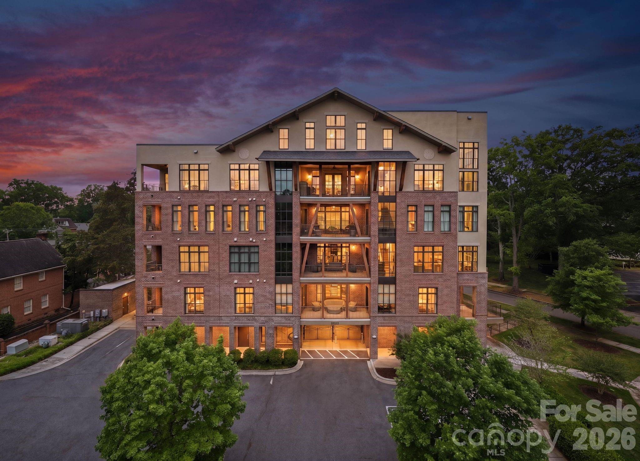 Located in the heart of Myers Park, 2312 Selwyn Avenue was constructed in 2018. This home offers almost 3000 sq feet of condo living with 3 bedrooms/3 full baths and two terraces. The kitchen has custom cabinets with glass inserts, walk in pantry,  Shaws farm sink and high end appliances, including a beverage refrigerator. All countertops are Calcutta gold marble. The kitchen is open to the spacious living spaces. There is a double sided gas fireplace in the dining room and on the covered terrace accessible from the dining room. An additional covered terrace is located off of the primary bedroom and family room. The light filled primary bedroom and bathroom suite features a large custom closet, access to the laundry room and heated bath floors.  There are two additional bedrooms, each with its own en-suite bath. Visual Comfort lighting throughout, custom hardware by Katonah Hardware and Farrow and Ball painted cabinetry are a few of the custom details. There are two covered and secure parking spaces as well as ample guest parking and onsite storage. The terrace views overlook a park like setting, which is rare to find in Myers Park.