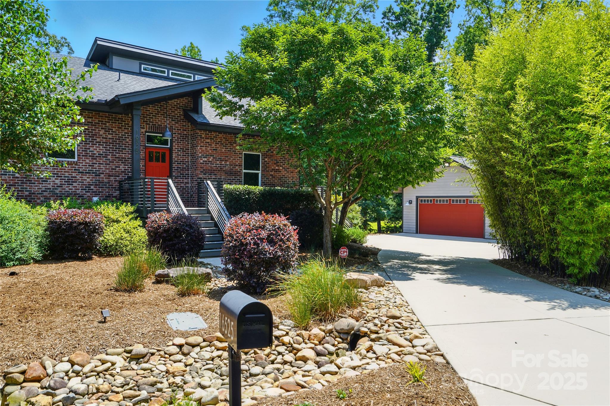 Just say no to cookie cutter! This stunning modern home blends bold industrial design with luxurious finishes—all set against the serene backdrop of Lake Wylie. Featuring exposed beams, metal ductwork, stainless railings, floating staircase, & tons of character throughout. The open main level offers a beautiful kitchen w/ granite counters & high-end stainless appliances, a vaulted great room, & screened porch w/Trex decking- ideal for relaxing or lakeside dining. Spacious primary suite boasts unique loft space, huge walk-in closet & spa-like bath. Lower level includes a 2nd bedroom, full bath, & flexible living space. Enjoy peaceful lake views, patio w/ firepit, outdoor shower, & room for all your gear w/ a huge detached garage, carport/RV parking, & bike stand! Apply for dock permit to launch your boating adventures.  Close to shopping & dining, yet tucked away for that “away from it all” feel—this home is perfect for outdoor lovers and those seeking something truly unique.