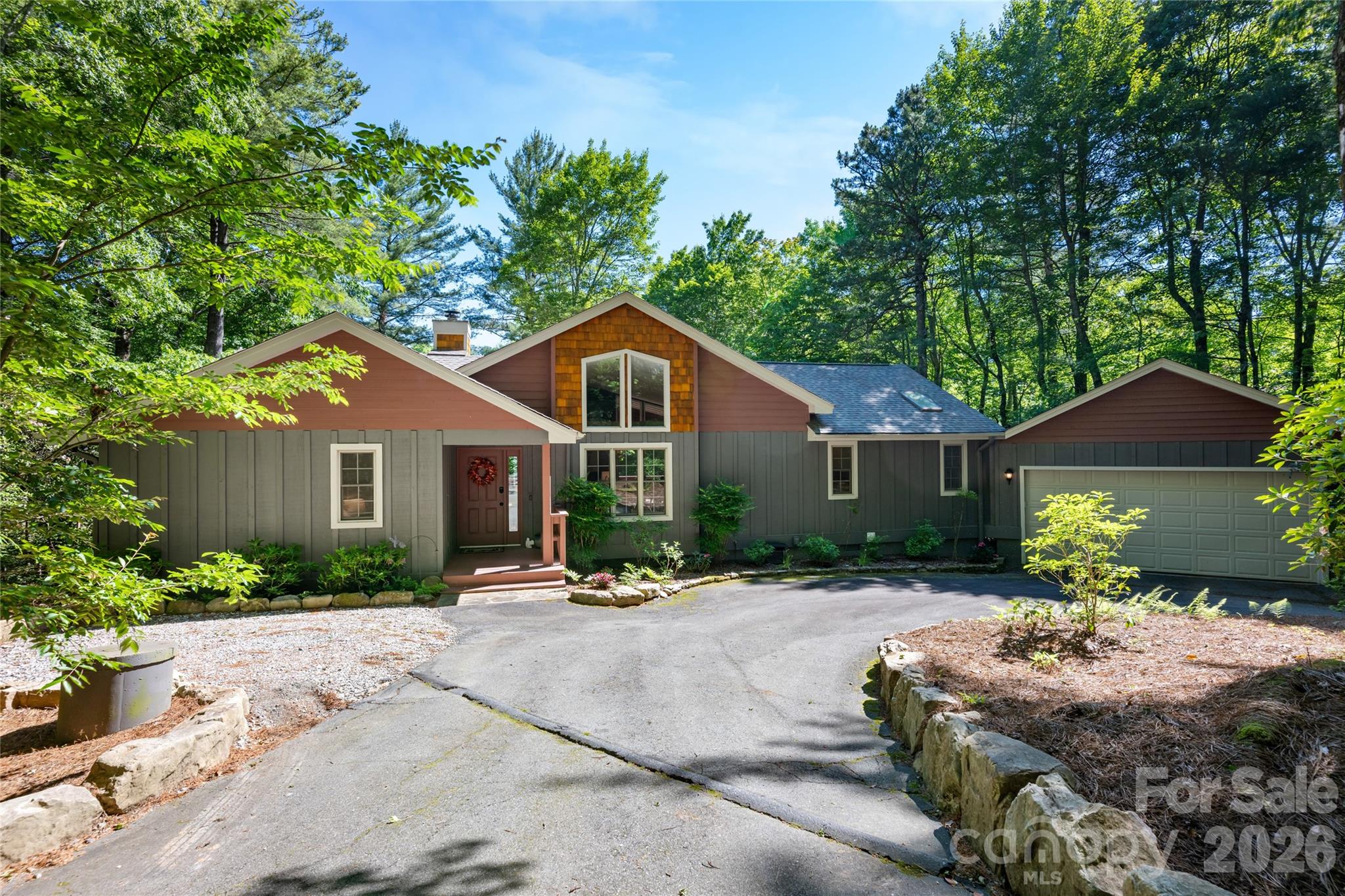 Welcome to your private mountain retreat with deeded lake access in the prestigious Lake Toxaway Estates. Tucked away on a peaceful lower mountain road, this beautifully appointed 3-bedroom, 2-bath cottage blends timeless mountain charm with modern convenience, creating the perfect getaway or year-round residence. The inviting open-concept floor plan seamlessly connects the living, dining, and kitchen areas, offering an ideal setting for both relaxed everyday living and effortless entertaining. The well-equipped kitchen features premium Bosch appliances and abundant storage, making meal preparation a pleasure. Offered fully furnished and move-in ready, this smart home is equipped with a Ring™ Video Doorbell, Security System, Floodlight Cameras, and a Nest™ thermostat, providing comfort, security, and peace of mind from day one. Step outside to the partially covered deck overlooking a spacious, fenced backyard—perfect for pets, outdoor gatherings, or simply enjoying the tranquil mountain surroundings. An attached two-car garage provides ample space for vehicles, recreational equipment, and additional storage. Just minutes from Lake Toxaway Country Club and its exceptional amenities, you'll enjoy easy access to golf, boating, tennis, dining, and a vibrant social scene. Combining location, lifestyle, and value, this is one of the most compelling opportunities in Lake Toxaway Estates. Membership to LTCC is based on application and availability.
