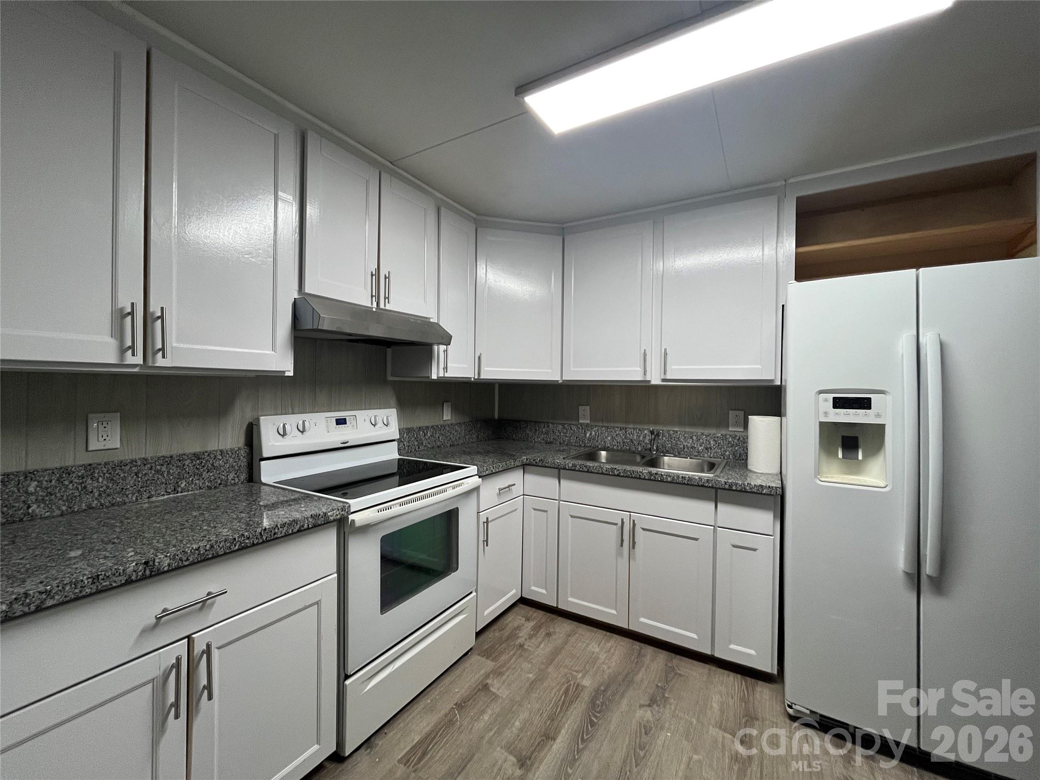 Investor special! $16,500 annually.

This cozy 2-bed / 1-bath home was recently refreshed with kitchen updates including all-new cabinets and stone countertops, and LVP flooring throughout.