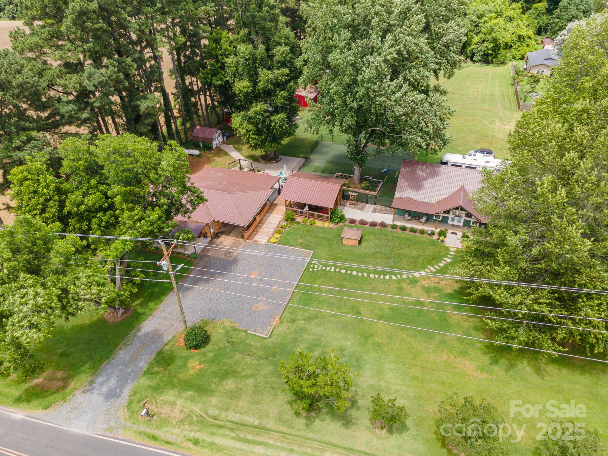 This well-maintained property offers comfortable living in a peaceful countryside setting. Step inside to discover a thoughtfully designed open floor plan with a spacious living area that flows seamlessly into the dining space and fully renovated kitchen. The kitchen boasts granite countertops, brand-new cabinets, and modern appliances. Outside, enjoy the tranquility of rural living from the large gazebo, or let pets roam freely in the fenced dog pen with turf. The detached 2-car garage with an additional carport provides covered parking and storage, while the separate workshop is ideal for DIY projects or hobbies.

One of the standout features of this property is the expansive 1,500 sq ft "she shed" — a versatile space complete with a full bathroom and a large closet, perfect for use as a guest house, studio, home office, or recreational retreat. With modern updates, functional amenities, and unique outdoor features, this home is truly a rare find.