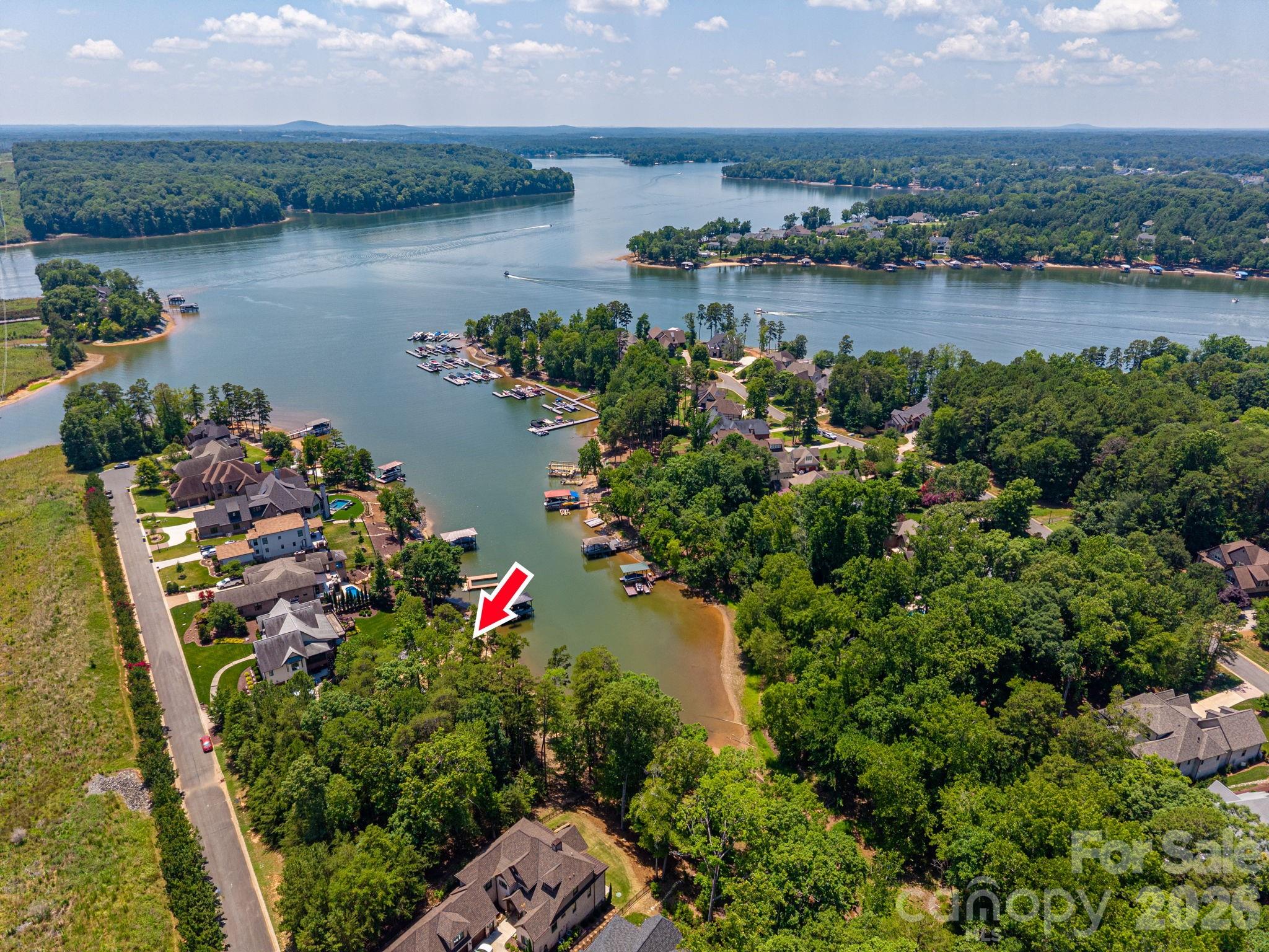 Beautiful waterfront lot in Reflection Bay, a gated Lake Wylie community in Belmont. Build your dream home and enjoy water views, a clubhouse, community pool, and a prime location just minutes from downtown Belmont's shopping, dining, and parks.