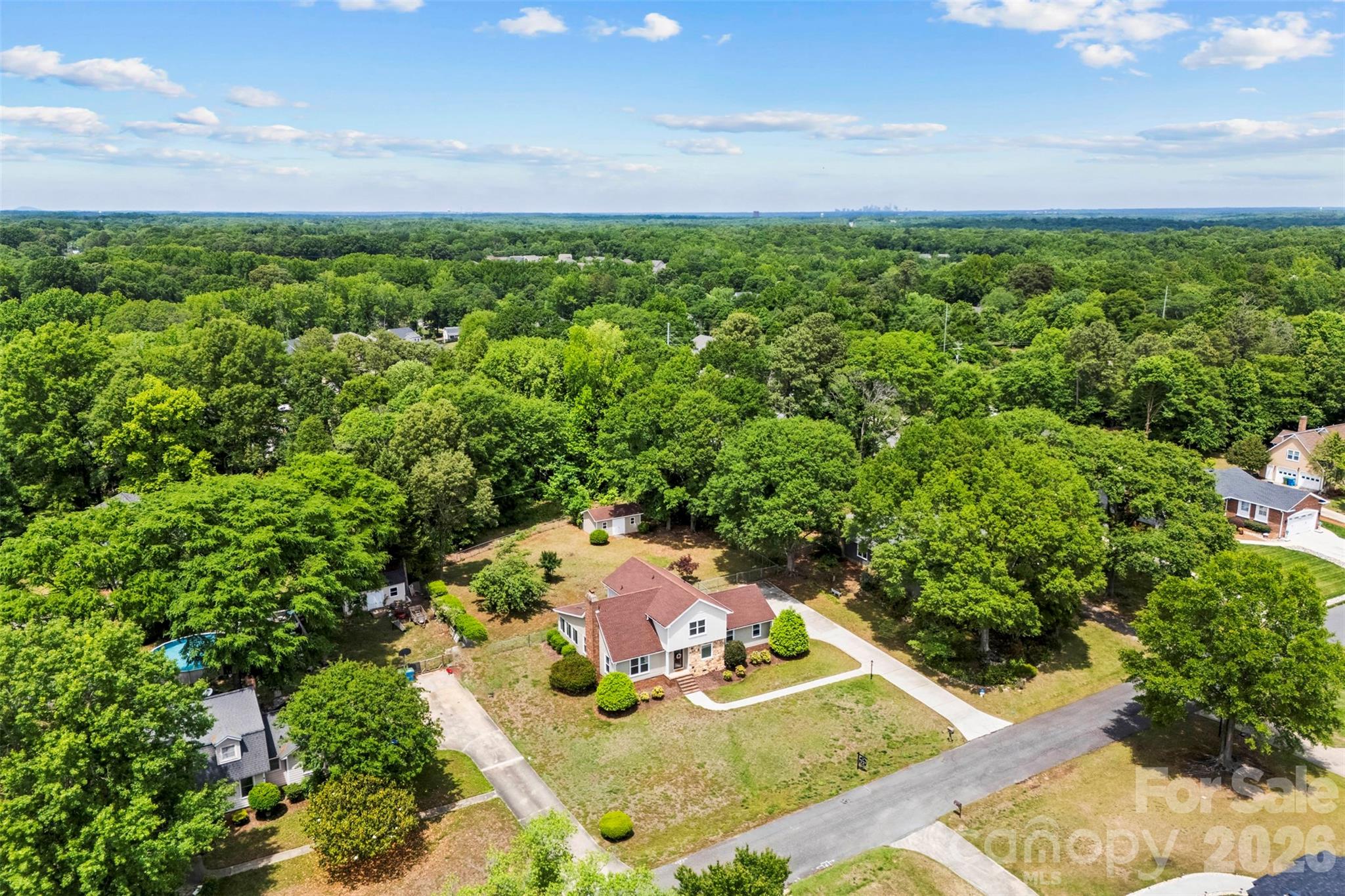 Welcome to the beautiful neighborhood of Friedfeld in Fort Mill, SC! This neighborhood is established offering mature trees, custom homes, and....the best part...no outlet! The no outlet neighborhood limits traffic and creates more privacy. This home is absolutely stunning. The moment you enter the door you will notice the tall, vaulted ceilings and stone fireplace in the living room. The beautiful sunroom overlooking the backyard is located right off the living room for an extension of the living space...perfect for entertaining. The kitchen has been recently updated and is a dream. Dining room is located off the kitchen. Bedroom on the main! Great size and has access for a full bath. Upstairs you will find the Primary suite with the luxury bathroom and the secondary bedroom (with a full bath!). Yes...each bedroom has a full bathroom AND walk-in closets. Garage is finished with epoxy flooring. Back yard is semiprivate, and fully fenced. Kitchen renovated spring 2024-new appliances, new windows/ siding/gutters 10/2025, HVAC 10/2024; Hot water heater replaced in last 8 years. Garage door and opener within past 5 years.  Roof 2015! Location couldn't be better, tucked away in a neighborhood AND close to everything Fort Mill has to offer.