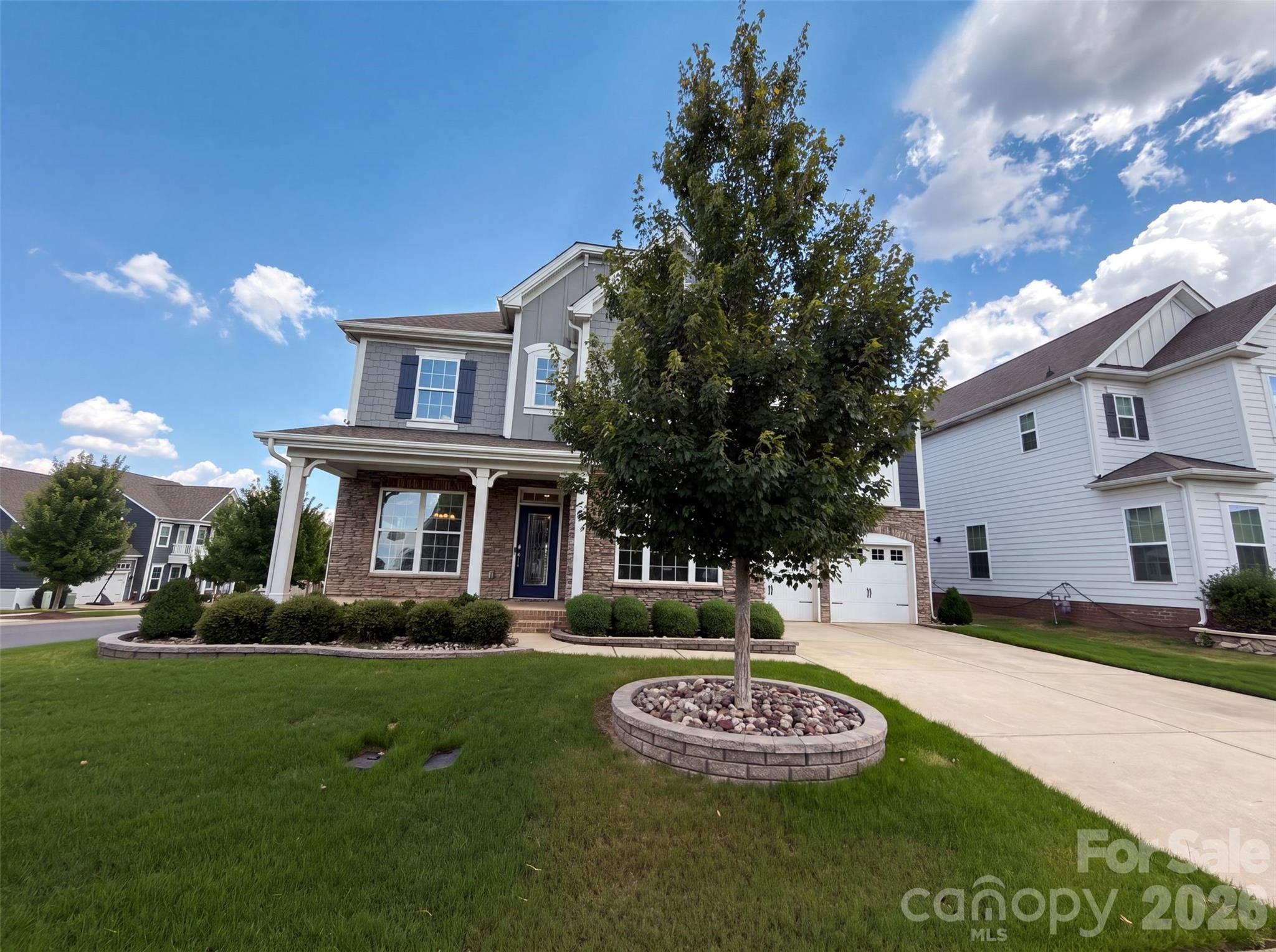 3001 Sterling Dr is a two-story Waxhaw home built in 2020 on a corner lot. The kitchen features a large center island with granite countertops, a tile backsplash, and stainless steel appliances, opening to the main living area. A fireplace anchors the great room beneath a coffered ceiling, adding warmth and a natural focal point to the central living space. The primary bedroom offers a carpeted retreat, and its bathroom includes a soaking tub, a separate glass-enclosed shower, and a double-sink vanity for added functionality. A fully fenced backyard extends the usable outdoor space, and an upstairs bonus room adds flexible living area. A two-car garage and a dedicated laundry room provide storage and convenience, and clean interior finishes complete this well-maintained residence with practical amenities in every room.. Included 100-Day Home Warranty with buyer activation