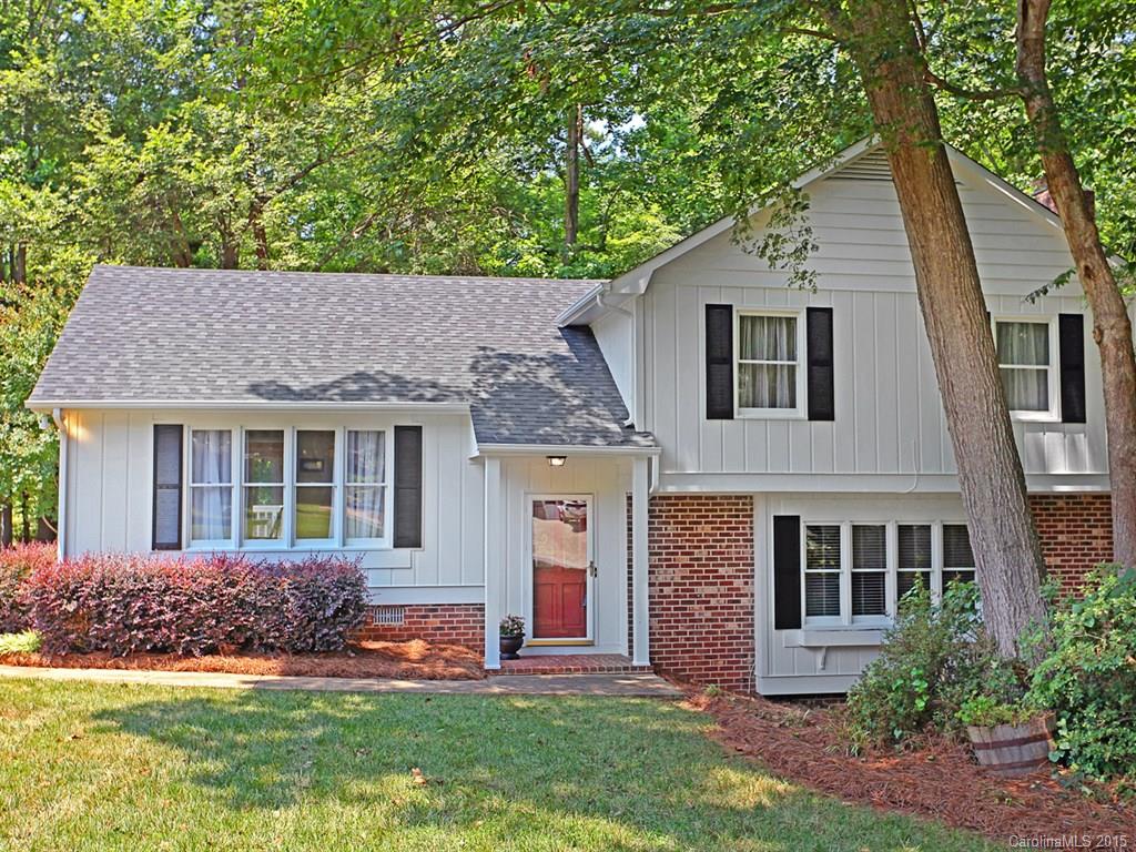 This Southern Beauty Glows! Updates GALORE! Fabulous living spaces only a few steps away; formal Living & Dining Rooms. Upgraded Kitchen with custom cabinetry, granite, SS smooth elec stove/oven, Breakfast Area & plantation shutters. Relax in the Den & Guest/Teenager Suite. NEW carpet, windows, & exterior paint, lighting fixtures. Deck overlooking wooded view. Storage Bldg. Highly sought after Old Orchard neighborhood, w/award winning Ft Mill Schools & walking distance to NEW Elementary school!