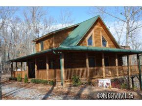 Beautiful 2000+ Sqft Log Cabin-Perfect Mountain Cabin that has it all! This cabin has a Bedroom & Full Bath on all 3 levels. Granite countertops & Top End Appliances in Kitchen with attached Dining Room. Large Open Living Room with Stone Fireplace, Hardwood Floors, full wall of Windows to Enjoy Seasonal Mtn Views. Large Master Bedroom with Sitting Area & Master Bath-Shower & Jetted Tub. Basement level has been completely renovated & has 2 Bedroo