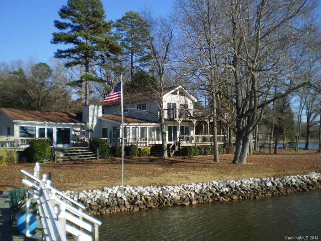 This is a great opportunity on Lake Wylie on Little Allison Creek.  Nearly 300 ft of shoreline, with deep water, 2 docks, and a boathouse.  Unique older home is in good condition and very livable as it is, but could be renovated to be great! Awesome lake views from inside the home as well as from the large deck and balcony.