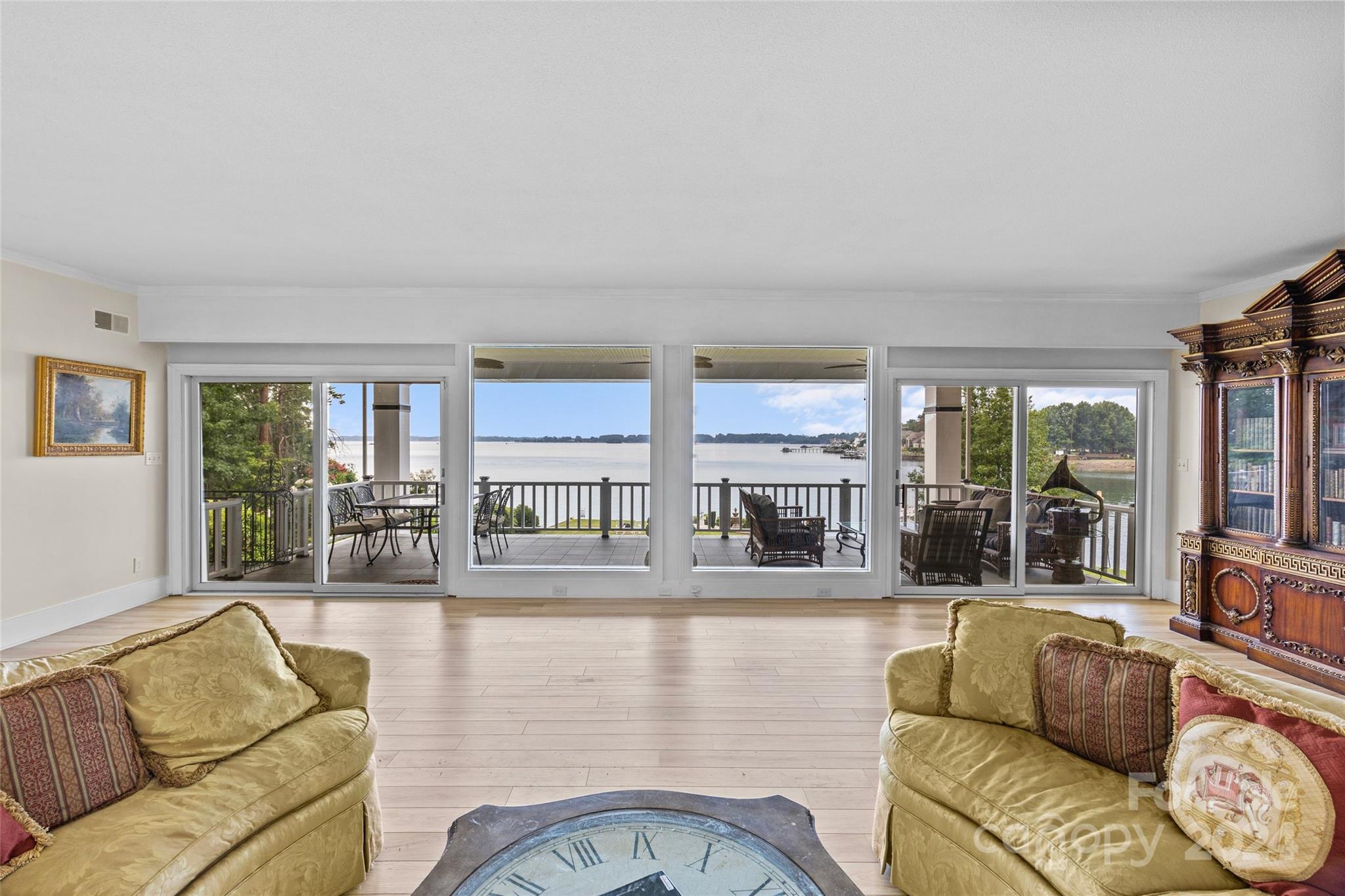 "Wow" will be the first thing you think as you walk around the corner from the entry way of this home.  The large picture windows that span the back of this home provide for some of the most breath taking views on Lake Norman.  The inviting back deck is the centerpiece for the vast open water landscape this home offers.  Sunrise from the back porch and sunsets down on the large dock w/sailboat slip jet ski launch and boat lift.  The back yard has a rare and hard to find all brick boat house on the retaining wall of Lake Norman. The flat back yard and grandfathered boat house is ready to be retrofitted into the perfect outdoor oasis.  Plenty of room for the pool of your dreams.  This 5 Bedroom 3&1/2 bath home is a must see.