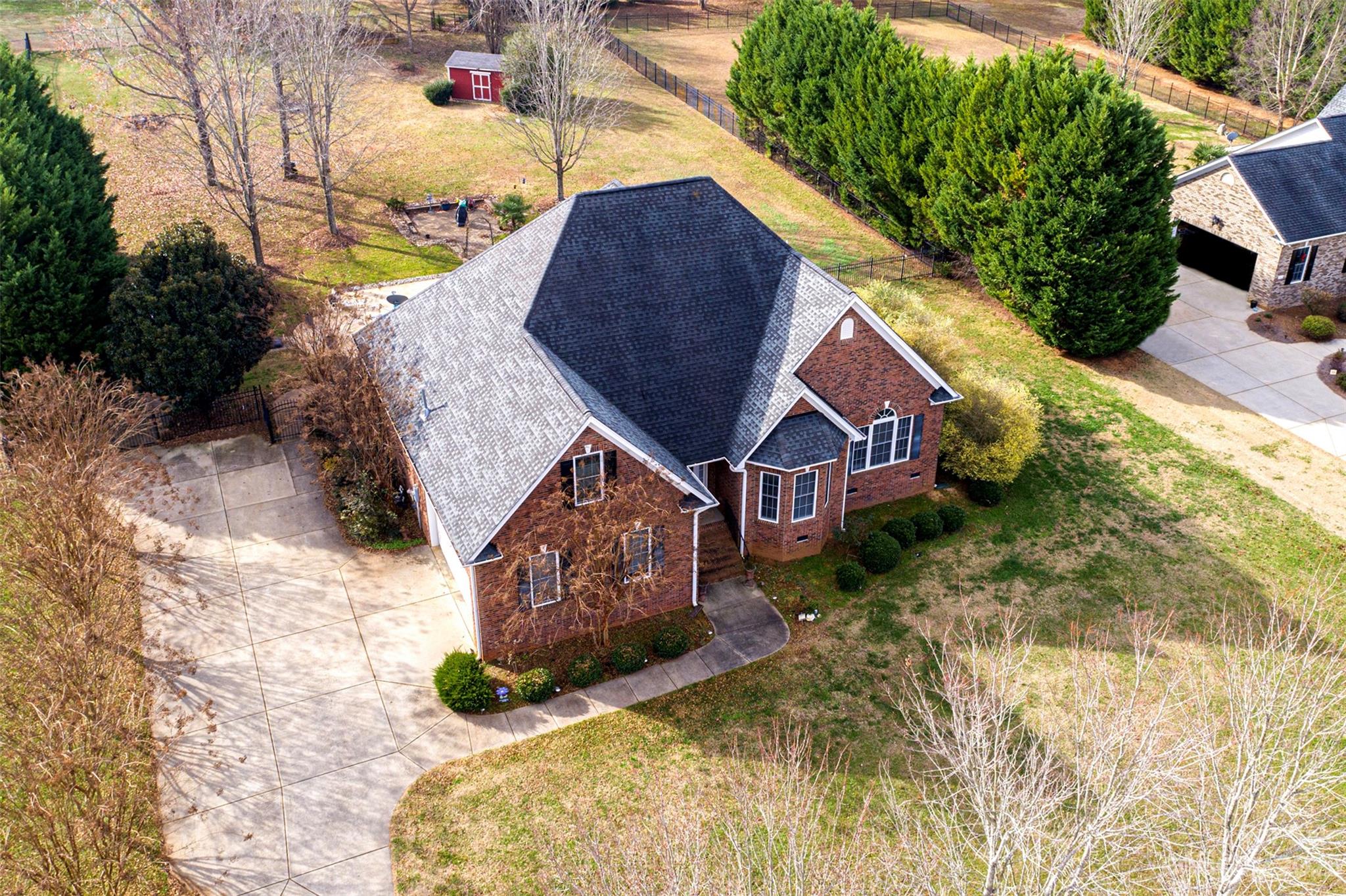 Welcome to this charming full brick home located on a cul-de-sac in the desirable Homewood neighborhood! Inside you will find a well designed layout that offers both functionality and comfort. This spacious home is filled with natural light, gleaming hardwood floors, crown molding throughout main level, and a gas fireplace, creating an inviting and welcoming atmosphere. The kitchen features stainless steel appliances, granite countertops, a convenient layout and ample storage space. The primary bedroom is located on the main level with a tray ceiling, ensuite with soaking tub and dual vanity. Two additional bedrooms on the main level, one with a vaulted ceiling and the other with a bay window allowing tons of natural light.  Upstairs you will find two sizable bedrooms and a loft/office/flex area. Step outside into your own private oasis perfect for relaxation or entertaining with a beautiful screened porch, inviting In-ground swimming pool and large, fully fenced back yard.