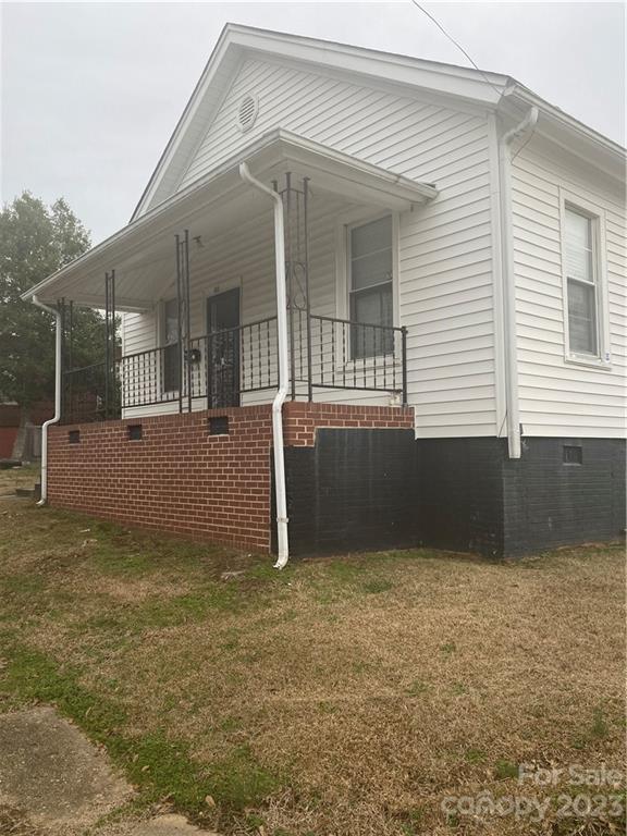 Situated on a corner lot, this 2 bed/1 bath home is solid. Outfitted with a Fenced Yard, Rocking Chair Front Porch, and a good sized Outbuilding. Home has High ceilings and bedrooms are sizeable. Seller is motivated. Home sold as is. Make Your Offer Today!
