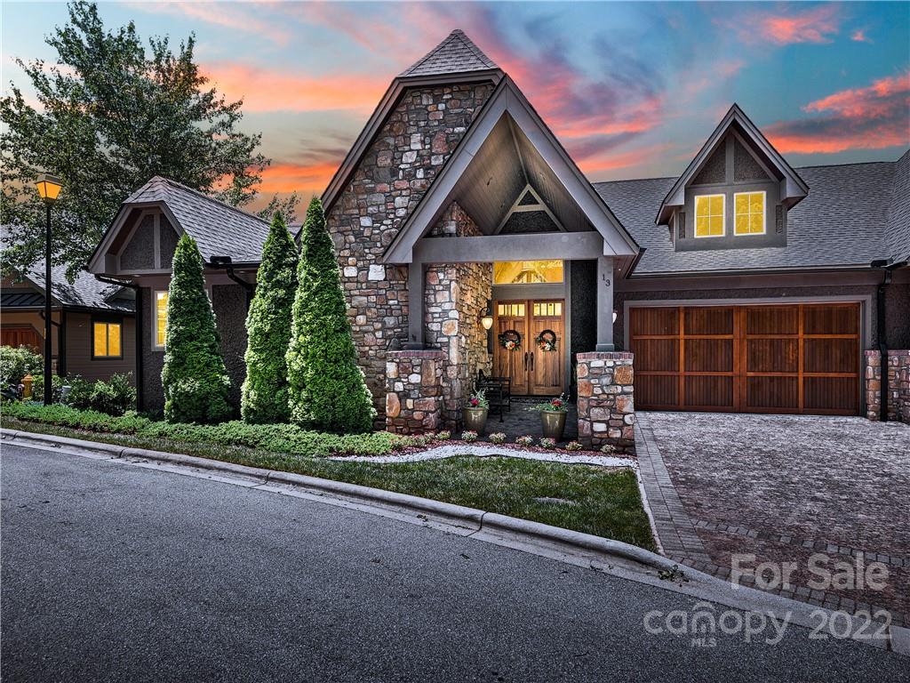 HIGHEST ELEVATION located in the premier community of Reynolds Mt.  3,400+ sq. ft.  Townhouse on a "private like" street with only 3 residences. 180 degree unobstructed view of layered Blue Ridge Mts. and downtown Asheville.  One owner;   seldom used.  ONE WORD DESCRIPTION:  VIEWS ! One level living with vaulted ceilings, vented gas fireplace, primary bedroom, full and 1/2 bath, laundry on main.  Expansive outdoor decks for entertaining. Both decks offer privacy from other residences. Terrace level offers 2 bedrooms, 2 full baths, family room, media room and deck.  Come escape the heat in your mountain oasis. Plenty of space for friends & family to enjoy privacy on two decks. Seller willing to sell furniture as well!