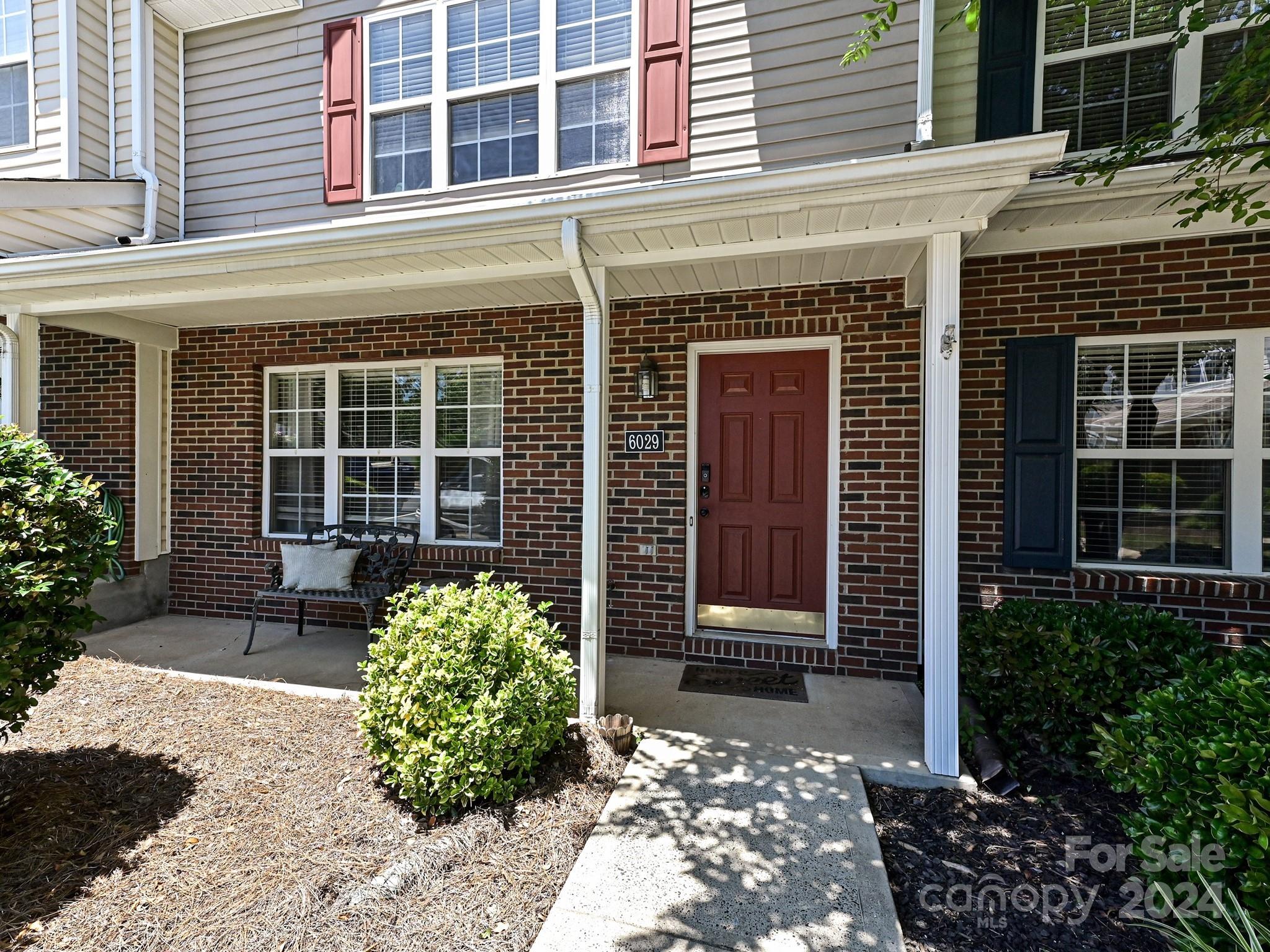Cute as a button townhome located right in the hustle and bustle of all that Indian Land, SC has to offer! This home is located on the perimeter of this adorable community giving its owners a wonderfully wooded, private backyard entertaining space. HVAC system, water heater, and furnace were all replaced in 2020!!! Flooring & toilets were replaced last year. This floor plan features a spacious living room & dining space right inside the front door. The kitchen has on-trend faux marble-looking counter tops, white cabinets, and kitchen island. The laundry room and half bath are on the main level. Upstairs features a split primary bedroom layout--Take your pick, both rooms are extraordinary with high vaulted ceilings and their own full bathrooms. No carpet in this one!!