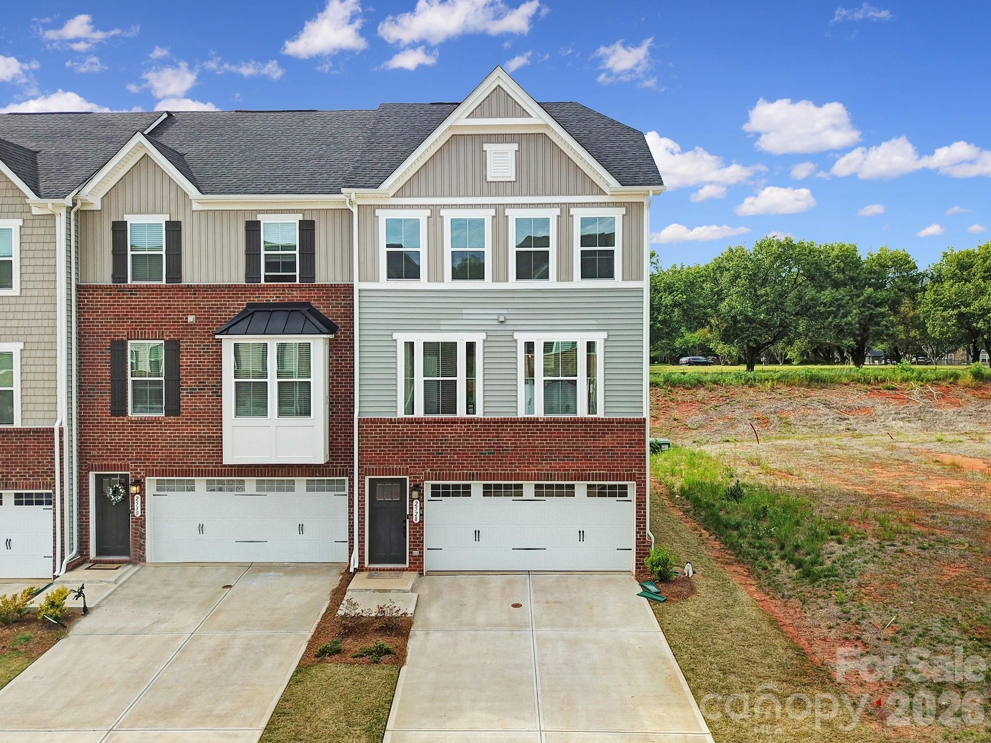 Best value in Regent Park! This end unit townhome with a two car garage combines space, convenience, and exceptional community amenities in one of Fort Mill's most sought after neighborhoods.

Located within a gated community, residents enjoy access to outstanding amenities including a community pool, clubhouse, tennis courts, walking trails, playground, exterior maintenance, and beautifully maintained common areas. Enjoy a low maintenance lifestyle while still having convenient access to shopping, dining, entertainment, I-77, and everything Fort Mill has to offer.

Inside, you'll find a spacious and functional floor plan filled with natural light. The end unit location provides additional privacy and extra windows, creating a bright and open feel throughout the home. The two car garage offers valuable storage and parking space, while the deck just off the kitchen provides the perfect space for entertaining or relaxing outdoors.

Seller is willing to provide a flooring credit with an acceptable offer for the carpeted areas of the home, allowing buyers the opportunity to personalize those spaces to their own style and preferences.

With similar floor plans in the neighborhood currently offered at higher price points, this end unit represents one of the best values available today. Whether you're a first time buyer, downsizing, or simply looking for a low maintenance lifestyle with exceptional amenities, this is an opportunity you won't want to miss.