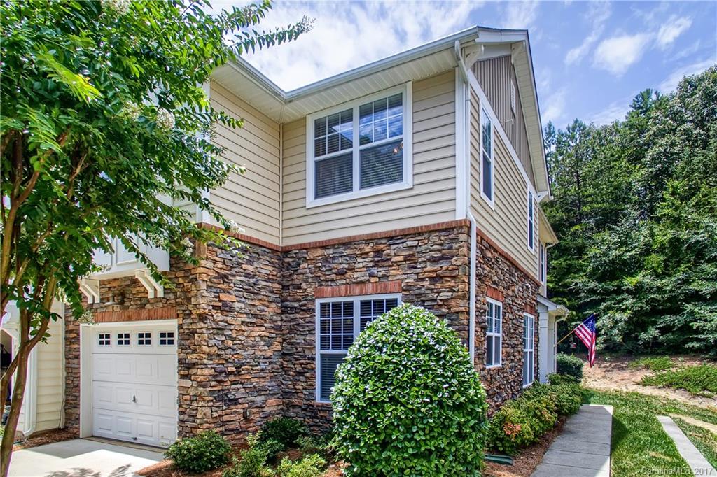 Fantastic former model end unit in popular Whitley Mills subdivision. Unit is move-in-ready with newly installed carpet. Enjoy plantation shutters, granite counter tops and an open kitchen concept for ample entertaining. Screened in porch faces the woods for excellent privacy. Unit has an attached 1 car garage plus numerous guest spots located directly across. You'll find Whitley Mills and this unit are ideally located to all daily amenities, I-77 (5 minutes) and award winning Fort Mill schools.
