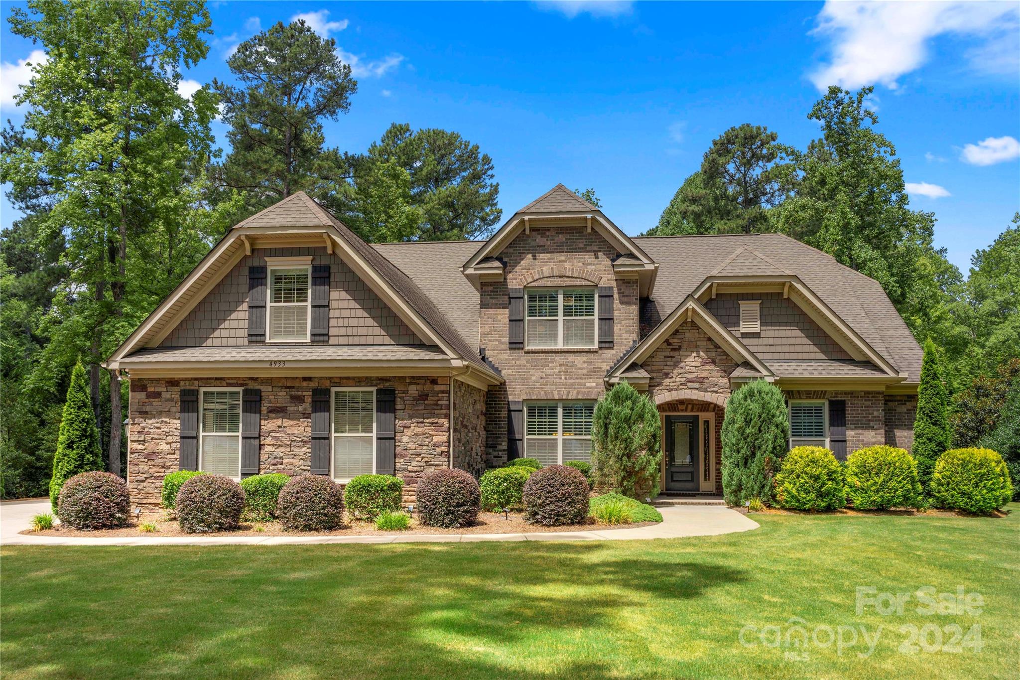 Welcome home to this full brick/stone ranch w/partial 2nd floor featuring bdrms/bath/bonus rm. This Elegant home offers a split bdrm floor plan, open & airy from the moment you walk in, w/large center kitchen island that opens to family room w/ built-ins, prewired for smart home systems, plantation shutters thru-out & stone fireplace. Built-in ovens, butler's pantry, granite countertops, tile backsplash, hardwoods on main, arches & columns, heavy trim thru-out. Open sunroom for additional living space allows plenty of natural light. This beauty sits on 1.39 leveled acres nestled in one of the most desirable neighborhoods in Lake Wylie. The Coves On River Oaks is a prestigious community within proximity to the lake, walking trails, shopping & Top Ranked Clover schools. This "gem" is surrounded by mature landscaping perfect for entertaining, playing & relaxing with a huge backyard to build your Dream pool. Owners planted over 200+ trees for added privacy & serenity. Low SC taxes.