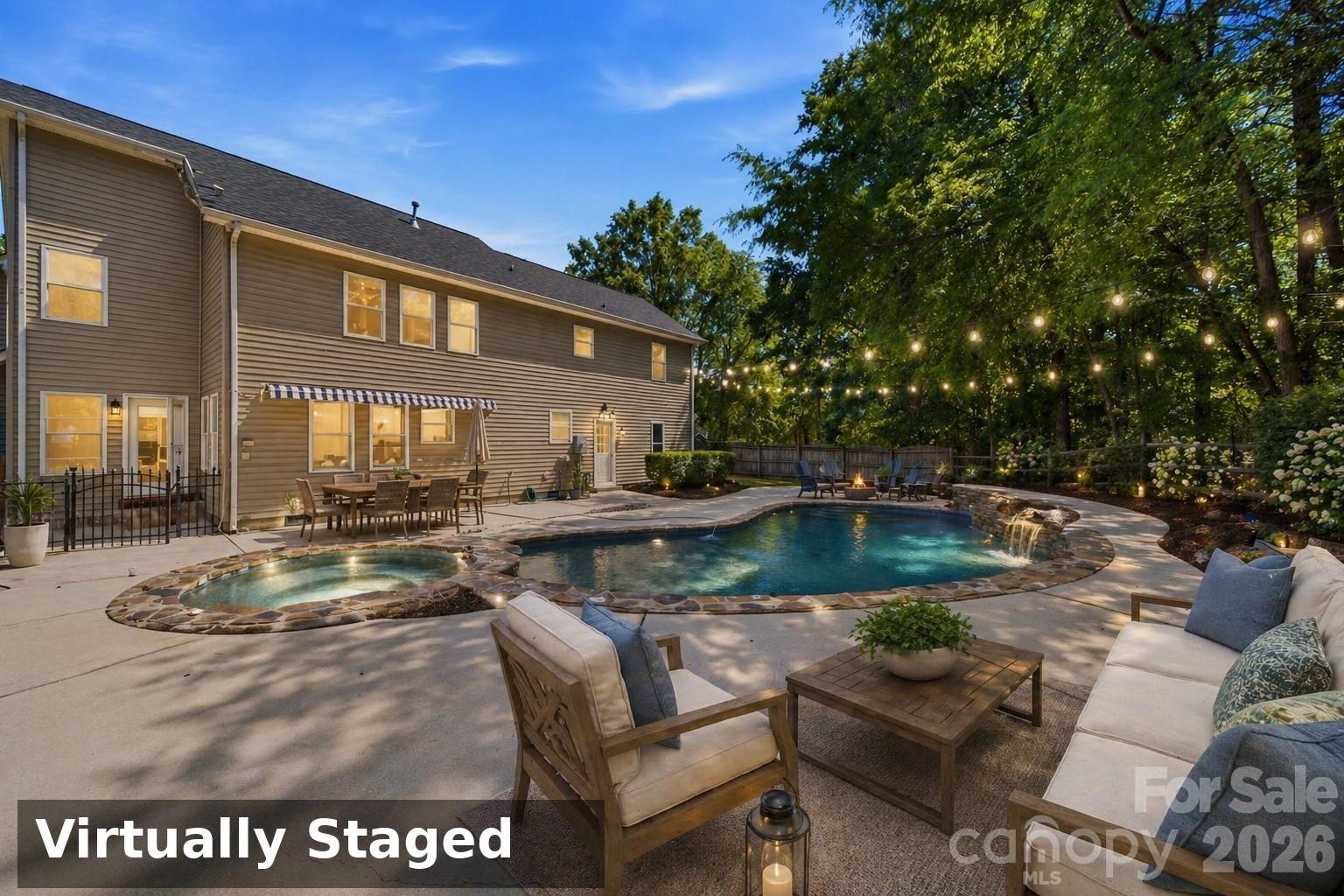 Tucked away on a spacious lot in desirable Clover, this charming two-story home offers the perfect blend of privacy, functionality, and recent updates throughout. Fresh interior paint, new flooring, updated lighting, and new toilets give the home a clean, modern feel from the moment you walk in.

The thoughtfully designed split-bedroom floorplan features a primary suite on the main level, providing comfort and convenience. Upstairs, you’ll find a welcoming common area with beautiful built-in bookshelves, an additional two bedrooms, and a versatile bonus room or bedroom—complete with its own kitchenette—making it ideal for a game room, guest suite, or multi-generational living.

Step outside to your own private retreat featuring a saltwater pool, perfect for relaxing or entertaining, plus a large separate detached 2 car garage for all your tools and toys.
This home has been virtually staged

A rare find with space, updates, versatility, and no HOA—this Clover gem is ready to welcome you home!