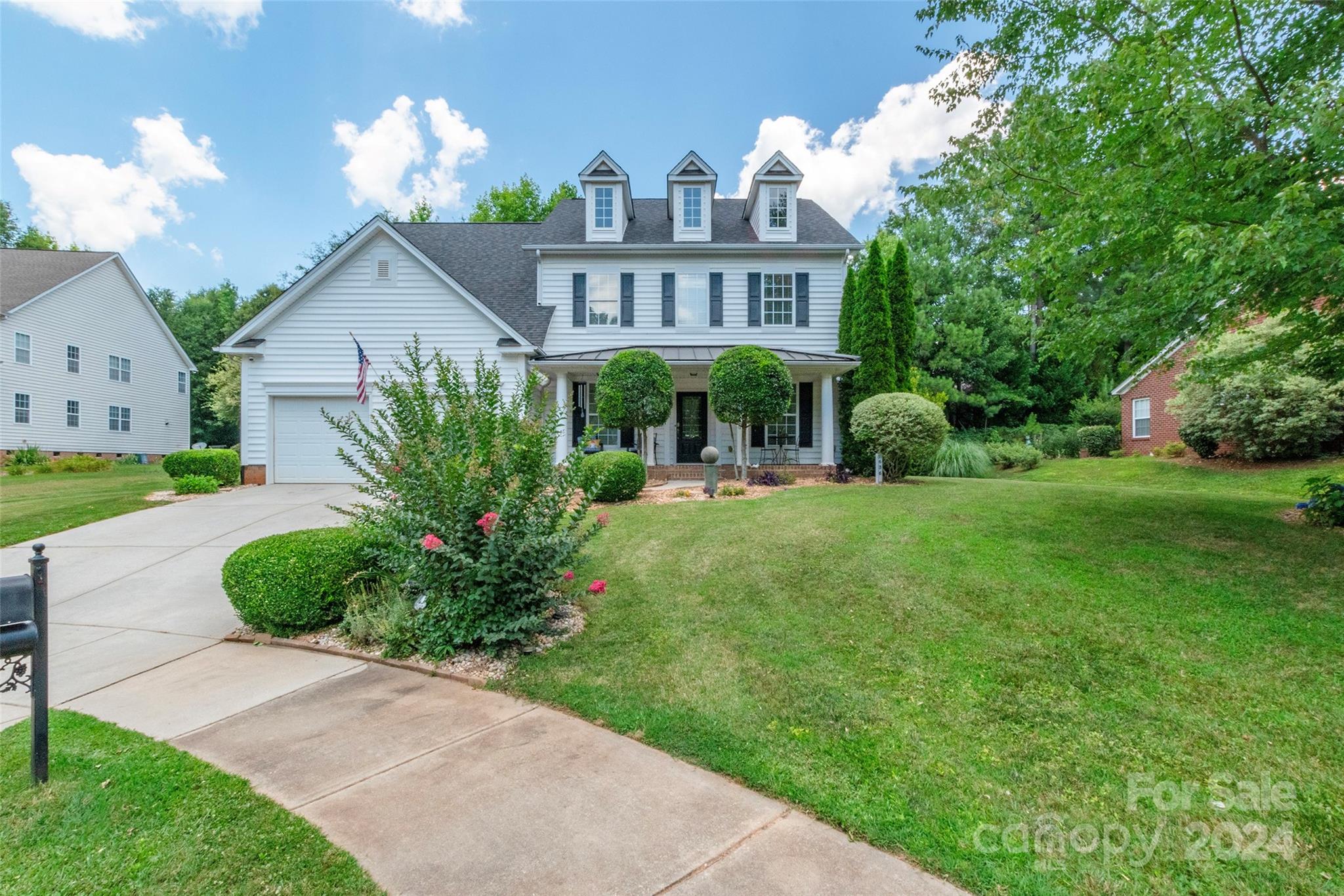 Nestled on a cul-de-sac, this 5 BD, 3.5 BA home combines luxury w/comfort. Enter through the covered front porch & be greeted by wood floors that flow through the expansive main living areas. The kitchen is a delight, overlooking the 2 story great room w/ fireplace, and featuring granite countertops, SS appliances, plenty of cabinet space, a pantry & connected breakfast area. The primary bedroom, located on the main level, provides a private retreat, while all other bedrooms are conveniently situated on the 2nd level. The 3rd level boasts an entertainment room & bonus room, ideal for a home office/play area. Updates abound throughout, w/new appliances, new garbage disposal, new carpet on the 2nd level, new HVAC system & new roof. Outside, the backyard with patio awaits. 4 zone irrigation. Close to shopping, dining, hospitals. Access to a community pool. Projector & screen on 3rd floor conveys (needs a bulb).
