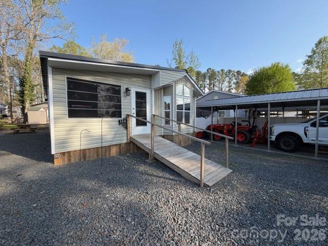New Listing 1 Br, with new roof, new heat pump, carport, level lot, updated electrical plumbing all in 2024, Enclosed porch with easy breeze windows, shiplap walls, wood ceilings, electric fireplace, strg building.  Buyer gets first right of refusal to purchase additional lot where motor home is parked when they decide to sale that property.  This property has so much to offer and has had so much updated county considers this property as a 2024 model now.