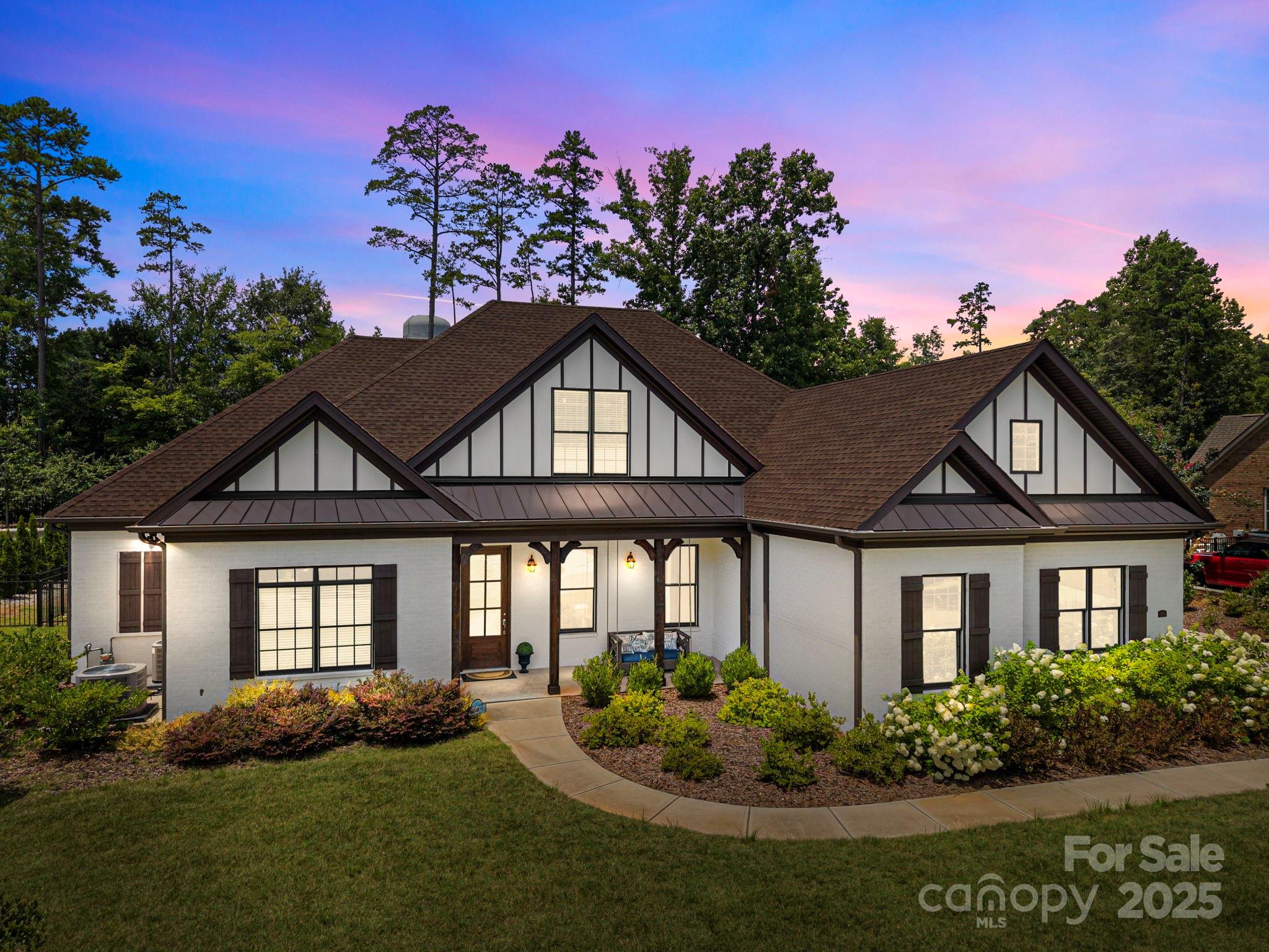 Come and discover this stunning custom-built 5 bedroom, 4-bathroom home in Fort Mill South Carolina! This spacious Stanton Heights 1.5 story ranch style home with F.R.O.G offers an open floor plan with soaring vaulted ceilings and luxury vinyl plank flooring throughout the entire house.  The gourmet kitchen flows seamlessly into the living and dinning areas-perfect for entertaining. Retreat to the beautiful primary suite featuring a spa-like bathroom and a custom walk-in-closet. Each bedroom includes its own custom closet for optimal storage. Enjoy the outdoors on the covered patio and take advantage of the generous attic storage and 3-Car garage. Located on a .35-acre lot in a desirable neighborhood with top rated Fort Mill Schools, plus access to a community pool, clubhouse and playground. Style, space and location! 
Just minutes from I-77, I-485. Anne Springs Close Greenway, Walter Elisha Park, Carowinds, Lake Wylie, Charlotte and Ballantyne.