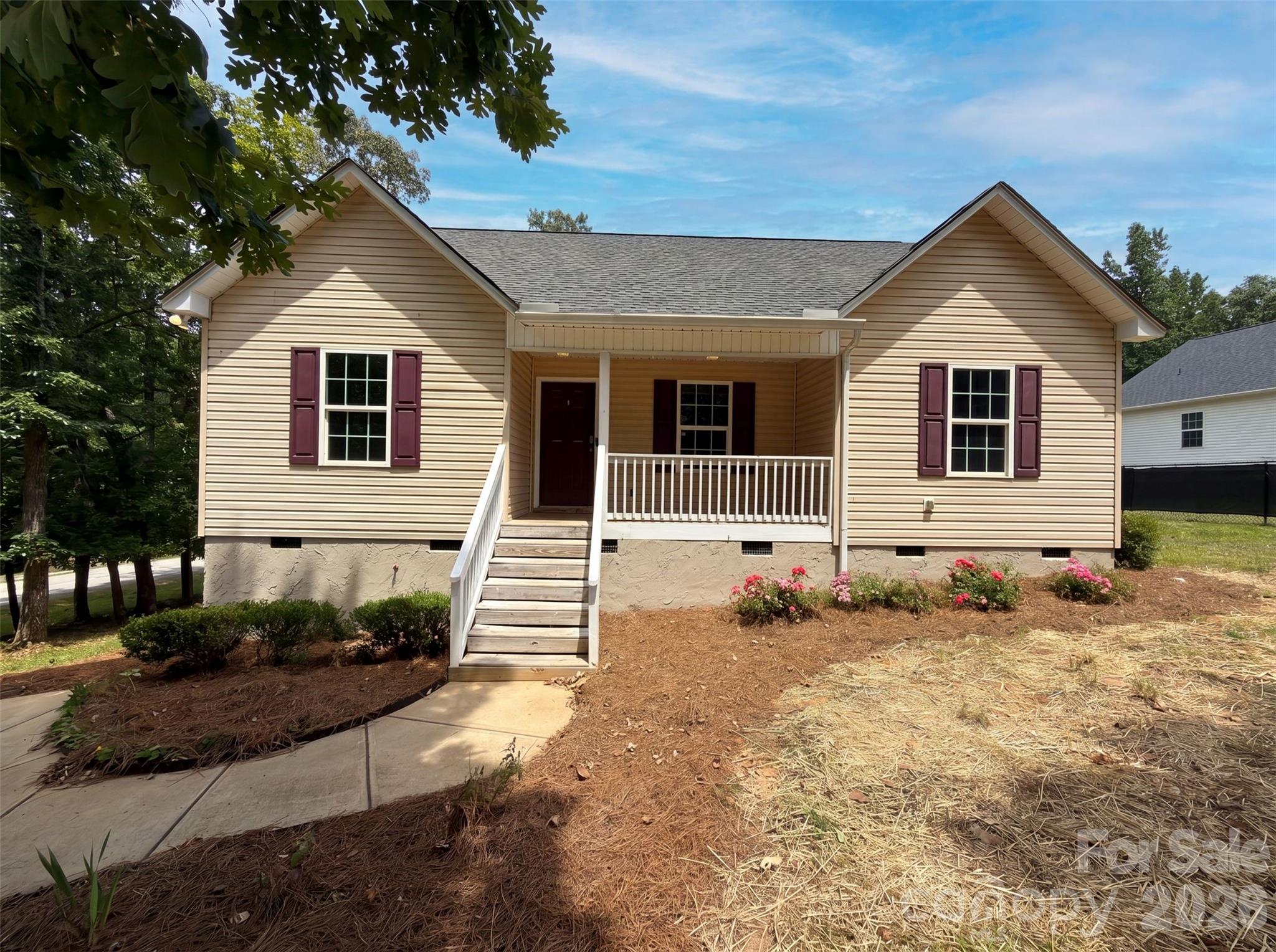 494 Hall Spencer Rd is a 1-story Catawba single- home built in 2017 with three bedrooms and two bathrooms across roughly 1,250 square feet on a generous lot of about 20,037 square feet. The kitchen pairs wood cabinetry with granite countertops and stainless steel appliances, opening to a hardwood-floored living and dining area beneath a vaulted ceiling for an airy, connected layout. The primary bathroom a dual-sink granite vanity for shared morning routines along with a tub-and-shower combination. A raised covered back deck extends the usable space outdoors and overlooks an expansive, tree-lined yard with room to spread out. The wooded setting and open interior complete this well-maintained residence with practical amenities throughout.. Included 100-Day Home Warranty with buyer activation