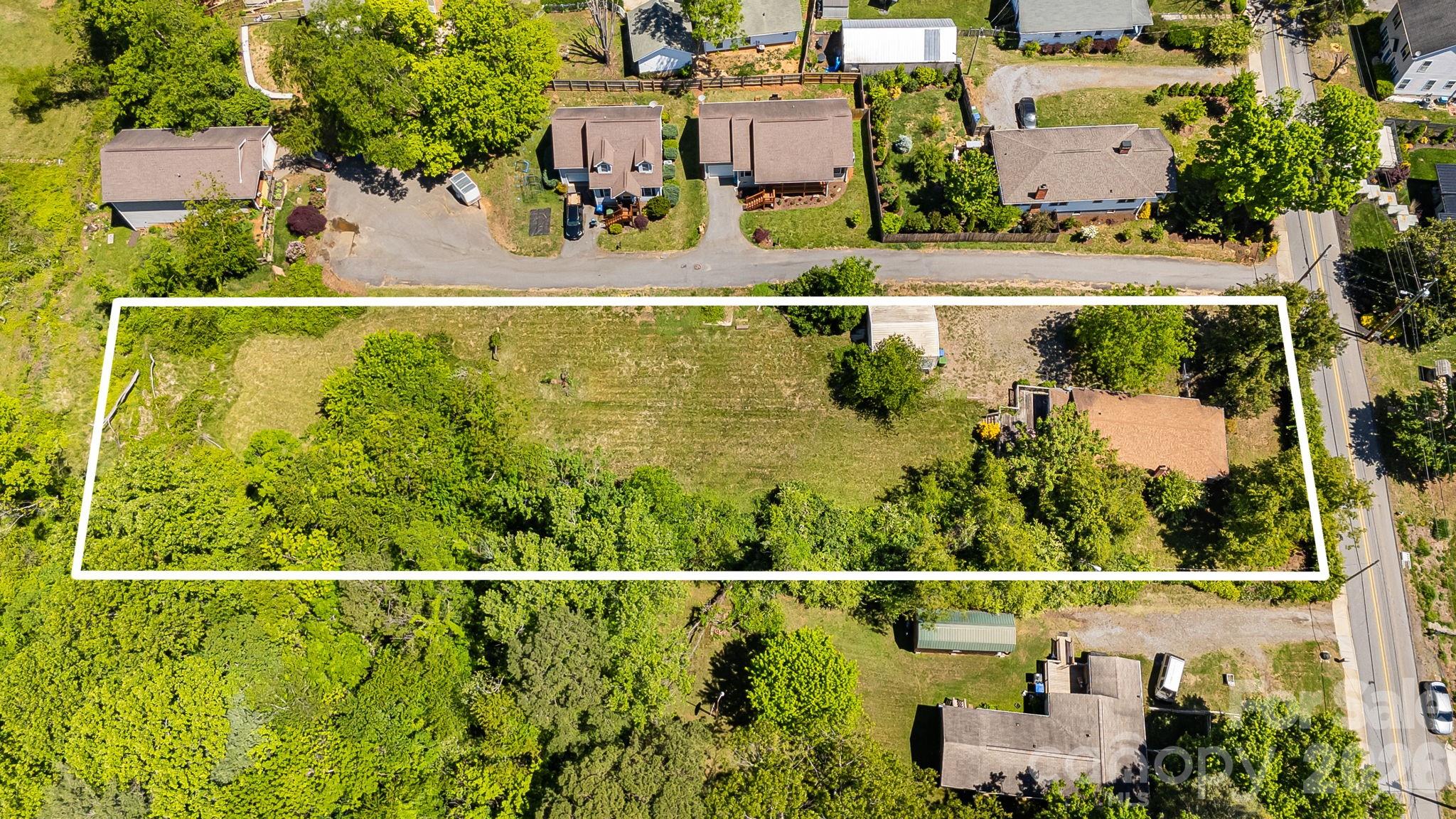 Investors take note! .93 acres in premium location in the heart of Oakley and East Asheville. Flat, buildable lots with access to city water and sewer.  Just minutes to Downtown Asheville, the Biltmore Estate, the Blue Ridge Parkway, and convenient to restaurants, shopping, and gyms.  This 3-bed, 1-bath home and potentially 4-6 lots (buyer to confirm) is the perfect place to put your new construction project.