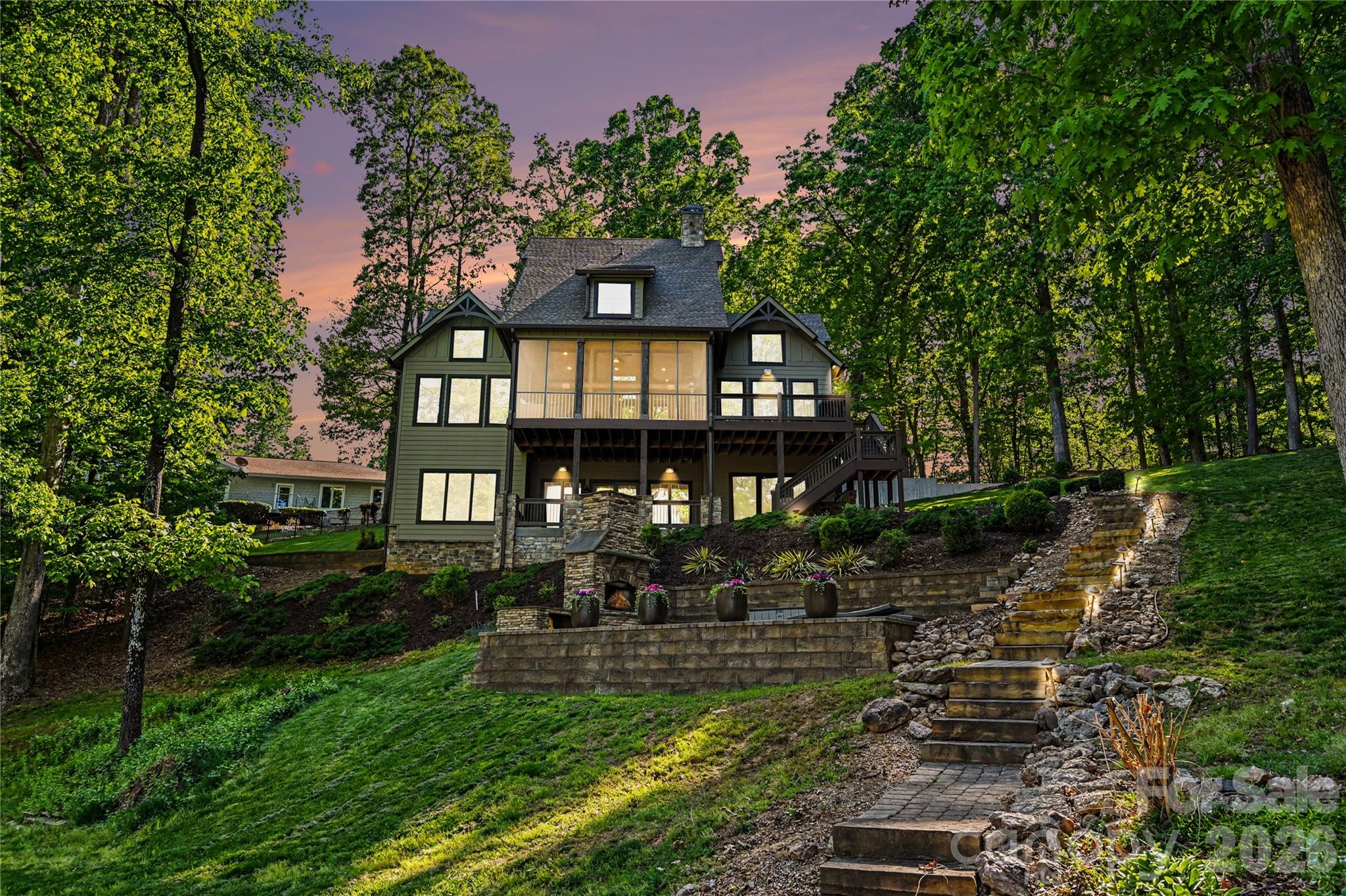 WATERFRONT OASIS! Tucked away on a quiet, wooded 1.23-acre lot with no HOA, this exceptional 4BR/3.5 BA plus flex room and 370+ sq ft FROG waterfront home offers park like and more expansive cove water views, privacy, and year-round deep-water access. Located in a protected cove with a covered floating dock, power, HydroHoist boat lift, and no wake concerns, it’s ideal for boating, swimming, and paddle boarding. 

Designed for relaxing and entertaining, enjoy a main level spacious screened porch and deck area, lower level patio area, outdoor wood-burning fireplace space, indoor gas fireplace, and natural gas grill hookup.

Inside, thoughtful upgrades and timeless design include a chef’s kitchen with Thermador appliances, casement windows, dedicated HVAC for all three levels, tankless water heater, water filtration system, and abundant storage. A versatile FROG with private access through the garage adds additional heated square footage, perfect for a guest suite, office, gym, or recreation space, with even more expansion potential available. 

Modern features include whole-house audio, Apple AirPlay, Ethernet wiring, Unifi networking, and surround sound prewiring. HardiePlank siding, irrigation, and two storage sheds complete this low-maintenance lakeside sanctuary.

A rare full package LKN home retreat!