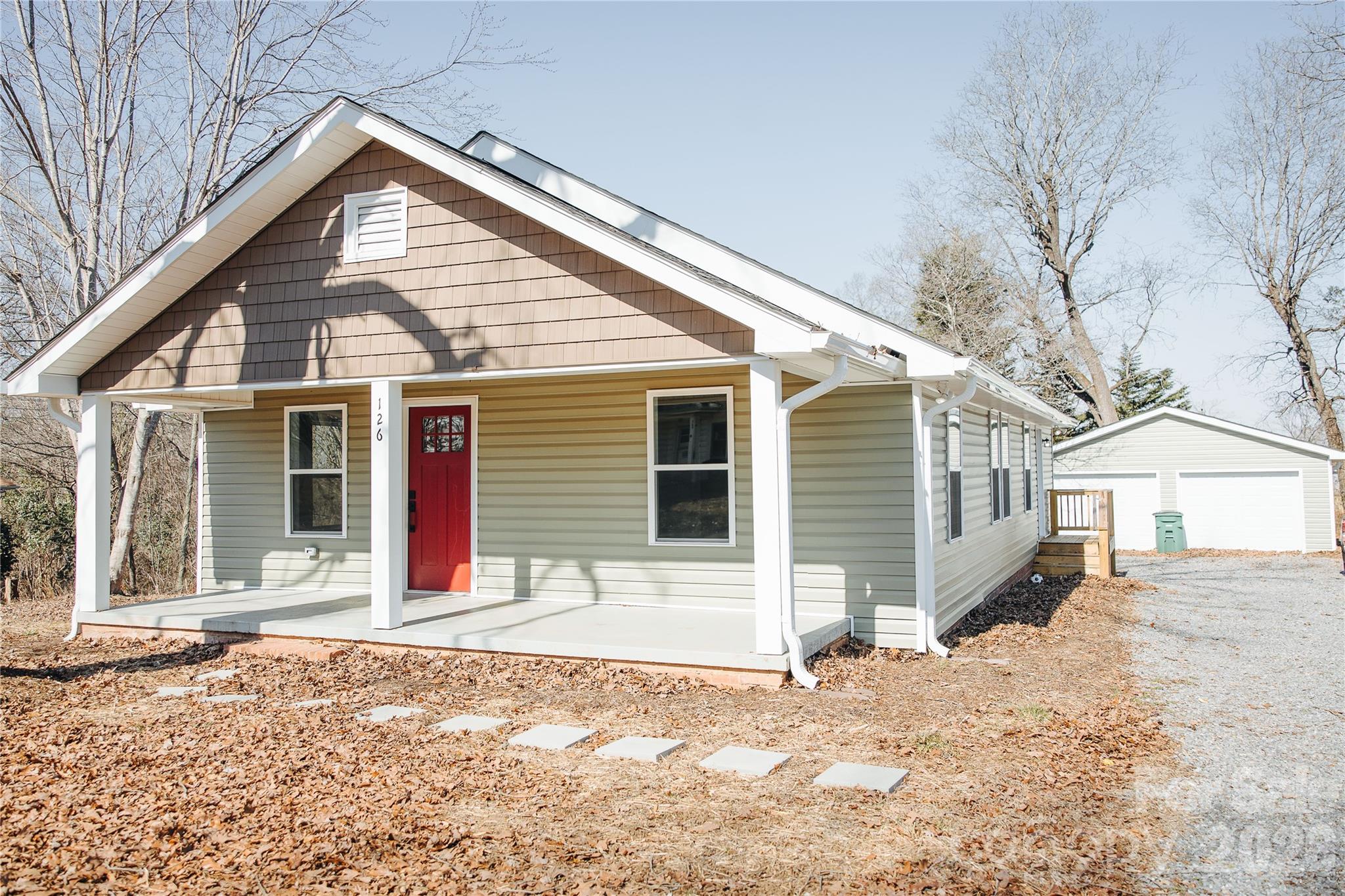 This stunningly transformed bungalow in the heart of charming Spindale, North Carolina, delivers instant curb appeal that goes far beyond impressive—it's a true showstopper from every angle!  Extensively renovated, this home exudes the ultimate "WOW" factor with attention to detail. The fresh architectural shingle roof with crisp white vinyl trim and gutters perfectly complements the vibrant green vinyl siding. All new doors and windows bring in abundant natural light, while a brand-new HVAC system ensures year-round comfort. The driveway boasts fresh gravel, and the yard has been recently seeded for that lush, welcoming look. The detached 2-car garage has been updated to match the house, complete with new doors and convenient remote openers—ideal for easy access and extra storage. Journey inside to a seamless, modern flow featuring durable wood-look vinyl plank flooring throughout, soft neutral walls, and bright white trim for a clean, timeless feel. The U-shaped kitchen is a chef's delight with ample cabinet storage, gorgeous granite countertops, and plenty of space to add a cozy breakfast nook or practical drop zone near the side entrance. A dedicated formal dining room offers flexibility for gatherings, while both bathrooms shine with elegant large-format tile tub surrounds for a spa-like touch. The home is connected to public utilities for hassle-free living. Nestled in friendly Spindale—part of Rutherford County's welcoming Tri-City area (with Rutherfordton and Forest City just minutes away)—you're perfectly positioned for small-town charm with big perks. Enjoy the Thermal Belt Rail-Trail for exploration, local spots like a taproom & pizzeria, nearby My Sweet vineyard & winery, and easy drives to iconic attractions like Chimney Rock, Lake Lure, and the Blue Ridge Mountains. This move-in-ready gem combines modern upgrades with classic bungalow character—perfect for first-time buyers, downsizers, or anyone craving low-maintenance luxury in a peaceful, convenient location.
Ready to fall in love? This one won't last long!