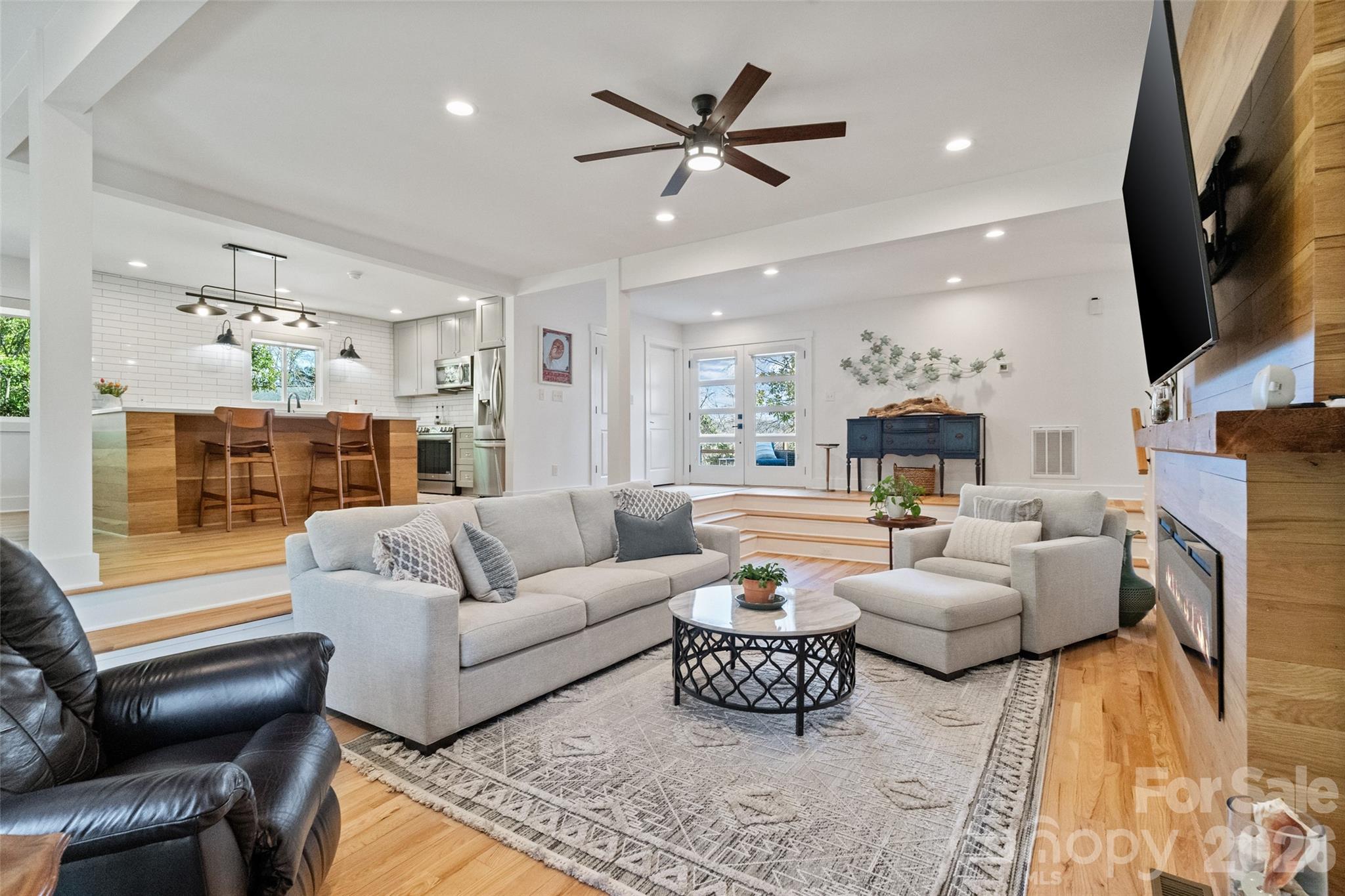 Welcome to this exceptional, fully renovated home in the highly sought-after community of Tega Cay. Completely transformed between 2022 and 2025, this residence blends modern luxury, thoughtful design, and breathtaking golf course and lake views in a truly serene setting.

Inside, the home showcases custom hardwood flooring throughout and a stunning chef’s kitchen featuring an artisan wood island, quartz countertops, stainless steel appliances, and an elegant backsplash. The bathrooms have been fully reimagined with tile flooring and showers, beautifully crafted vanities, and refined finishes. Additional highlights include a custom fireplace surround and mantle, Jeld-Wen windows with custom blinds, and a striking modern front entry door that enhances curb appeal.

Outdoor living is spaces offer spectacular views, an expanded multi-level deck addition, and professionally designed landscaping with retaining walls and custom hardscaping, new parking pad with three spaces and an expanded driveway with additional two spaces. Structural upgrades include a commercial-grade roof and a fully encapsulated crawl space with dehumidifier and dual sump pumps.

Major system upgrades include a complete HVAC replacement with new ductwork, updated electrical throughout, and new plumbing, offering comfort, efficiency, and peace of mind.

Located in Tega Cay, a premier lakefront community known for golf, trails, water activities, and top-rated schools, this remarkable home offers a rare combination of luxury, functionality, and scenic beauty.