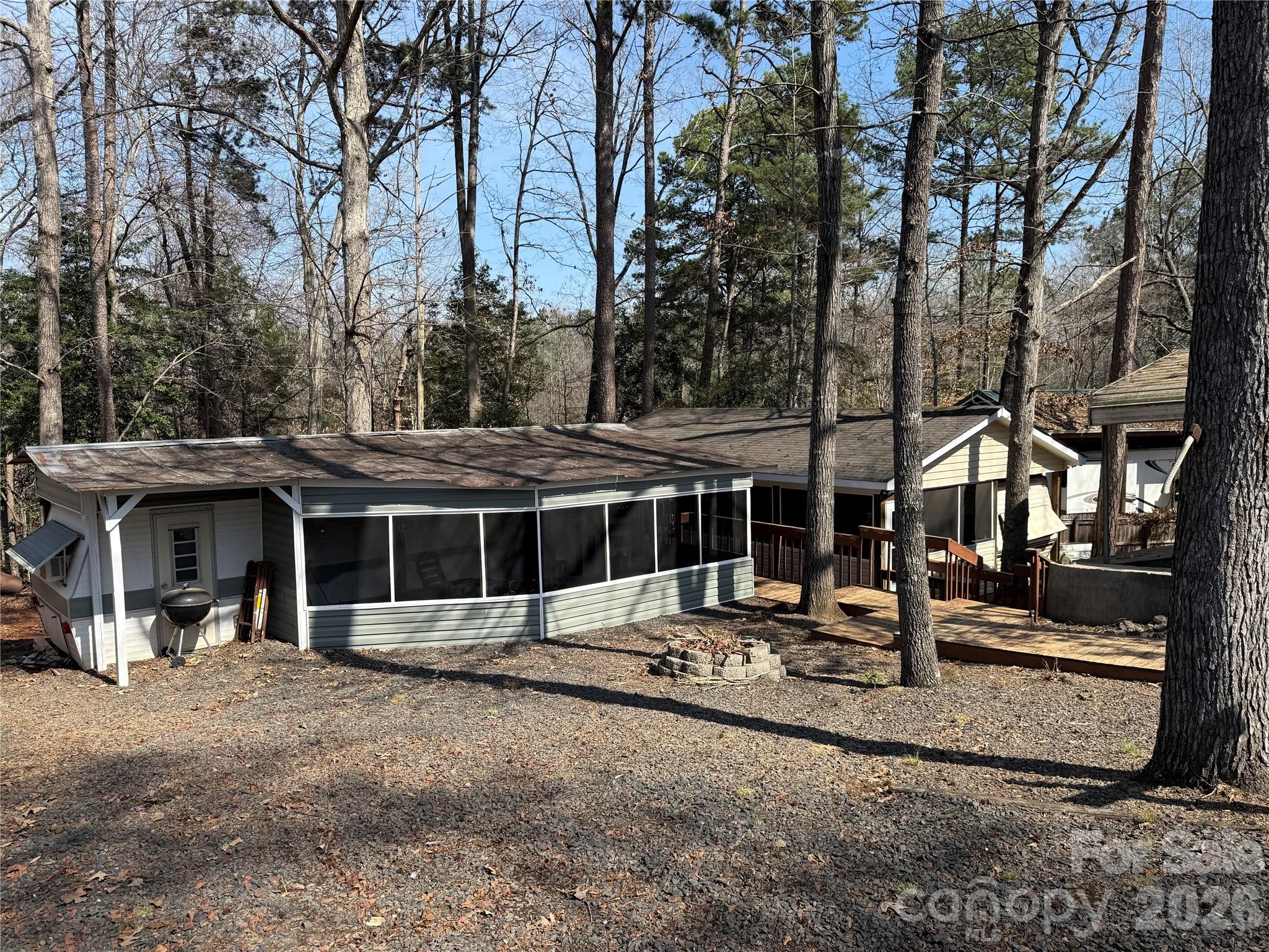 Two separate units, side by side. They share one power and one water. This is an opportunity to be together when you want and have separation when you want. 341 Lake Tillery Tr starts with a fabulous screen porch. Nice chairs, swing, table and chairs with a large TV. The shower is also on porch. Inside has new subfloor with updated flooring and paint. Newer furniture with chaise lounge on one side. Beautiful counters, good storage. Elec appliances on the counter to remain. Bar seating for dining. Nice size updated half bath with real potty. Comfortable bedroom with full size bed. 339 starts with a screen porch. Inside is new flooring and paint. Propane cook top, excellent storage, nice size half bath with real potty. (No hot water at 339). Comfortable sleeping with Full size bed. Both units have electric plug in heaters and window A/C. Propane Hot water on demand at 341. All furnishings included. 1985 Club Car with dump bed is included. No titles, Bill of Sale will be provided. All buyers must be with a realtor to gain entry to the community.