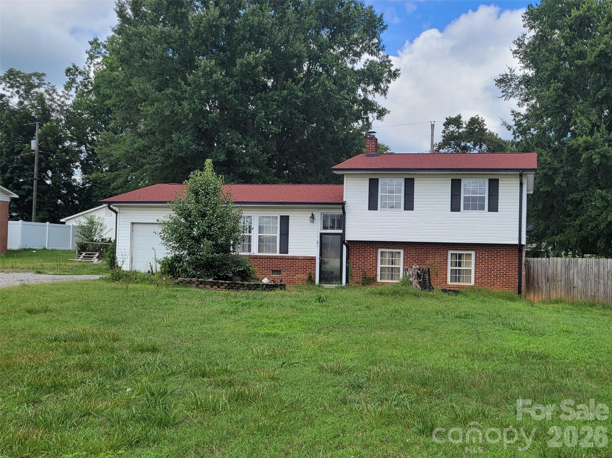 Lower level has a den with separate laundry and half bath. Close to downtown. Hardwood floors throughout. Wonderful tri-level design. Gas log fireplace. 3 Bedrooms and 1.5 bathrooms are on the upper level.