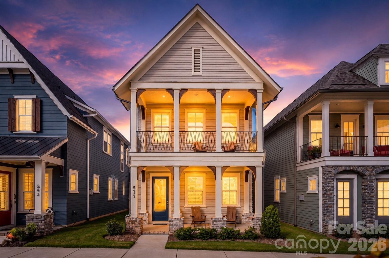 This is more than a home—it is a lifestyle.
Enjoy low-maintenance living in one of Fort Mill's most connected communities, where many daily conveniences are just steps from your front door. Springfield Town Center offers the ability to walk to Harris Teeter, Starbucks, restaurants, fitness and service providers, while the nearby Anne Springs Close Greenway provides miles of trails, lakes, recreation opportunities, and year-round events. The community's long-term vision includes conceptual plans for an even more walkable mixed-use environment designed to bring gathering spaces, local destinations, and everyday conveniences closer to home. While these plans remain conceptual and timing is unknown, they reflect the thoughtful direction of the area. Additional conceptual information is available for interested buyers during their visit.
Thoughtfully upgraded beyond its original build, this Saussy Burbank Modern Cottage combines timeless design with modern comfort and exceptional curb appeal. Expansive double front porches overlook peaceful green space, including a private upper porch just off the primary suite, creating inviting spaces to enjoy morning coffee, unwind in the evening, or simply take in the surroundings.
Since its original purchase, the exterior has been professionally repainted from Southern Peach to a classic neutral palette, creating a fresh, sophisticated appearance. Inside, luxury vinyl flooring extends throughout all bedrooms with no carpet anywhere in the home. Plantation shutters and blinds add style and privacy throughout, while the fully drywalled garage delivers a clean, finished look rarely found in similar properties.
The welcoming foyer offers a coat closet and a flexible space ideal for dining, a home office, sitting room, or whatever best suits your lifestyle. At the center of the home, the kitchen features stacked cabinetry, a walk-in pantry, butler's area, abundant storage, and a refrigerator that conveys. The adjoining family room is enhanced by custom built-ins and decorative ceiling beams, creating warmth and character while remaining open and functional for everyday living and entertaining.
A spacious drop zone with additional storage helps keep life organized and connects seamlessly to the covered rear porch and detached two-car garage with valuable walk-up attic storage above.
Upstairs, the primary suite serves as a private retreat with custom built-ins and direct access to the upper porch overlooking green space. The laundry room is thoughtfully designed with a utility sink, granite countertops, cabinetry, and pocket door. Two additional bedrooms and a well-appointed hall bath complete the second level.
For buyers seeking a lock-and-leave lifestyle, walkability, thoughtful upgrades, and a home that extends beyond its walls into the surrounding community, 539 Plowman Lane offers a rare opportunity to enjoy the best of Fort Mill living today while benefiting from the area's continued growth and investment.