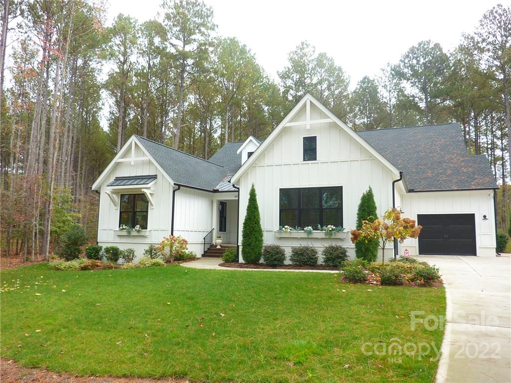 This stunning MOVE IN READY Ranch located in a gated resort style community.  A perfect escape from the hustle & bustle - 25 min to Ballantyne & 20 min to Waxhaw, 20 min to Rock Hill. Kitchen and Dining area has 14 ft Cathedral ceiling w/beam. Kitchen w/SS appliances, quartz countertops, pot filler & huge center island (seats 8).  Dining room has custom cabinets w/Beverage & wine fridge  & has access w/sliding doors to screened porch w/fireplace and heaters to enjoy year round.  Primary Bedroom has tray ceiling & primary bath has dual sinks, freestanding tub, Lg walk-in shower & custom closet w/access to laundry room w/custom cabinets. Secondary bedrooms w/Jack & Jill bath and walk-in closets.  Enjoy entertaining in backyard that has custom hardscape and covered hot tub area & Privacy trees.  Irrigation and Accent lighting in Front and Rear of home.  Riverchase Esates offers - fitness center, Large outdoor pool, basket ball court, Tennis/pickle ball courts & access to Catawba River