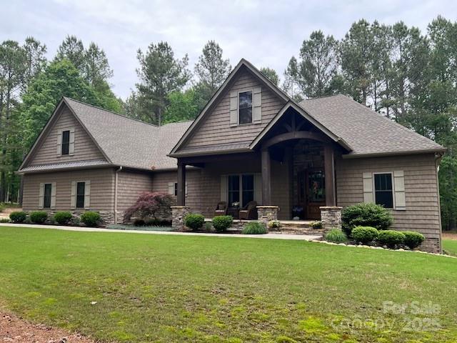 Experience lakefront living in the beautiful gated community of Anchors Landing.  Stroll from your home is your private boat dock, community pool, clubhouse, scenic ponds, pickleball courts, and miles of paved trails. Soaring solid timbers and a floor-to-ceiling stone fireplace create a warm and inviting great room, perfect for cozy evenings or entertaining. Handcrafted Knotty Alder cabinetry, granite countertops, upscale appliances, and a butler’s pantry elevate culinary experiences. A main pantry with custom shelving provides plentiful storage. Wake up in your primary suite to serene wooded views through a large picture window. The adjoining en-suite features an expansive open shower complemented by a 10x12 custom closet. The split bedroom layout offers abundant privacy.  The partially finished basement features a mini-split HVAC system for year-round comfort. A vaulted screened porch provides seasonal outdoor living. Lots within the community offer RV storage.