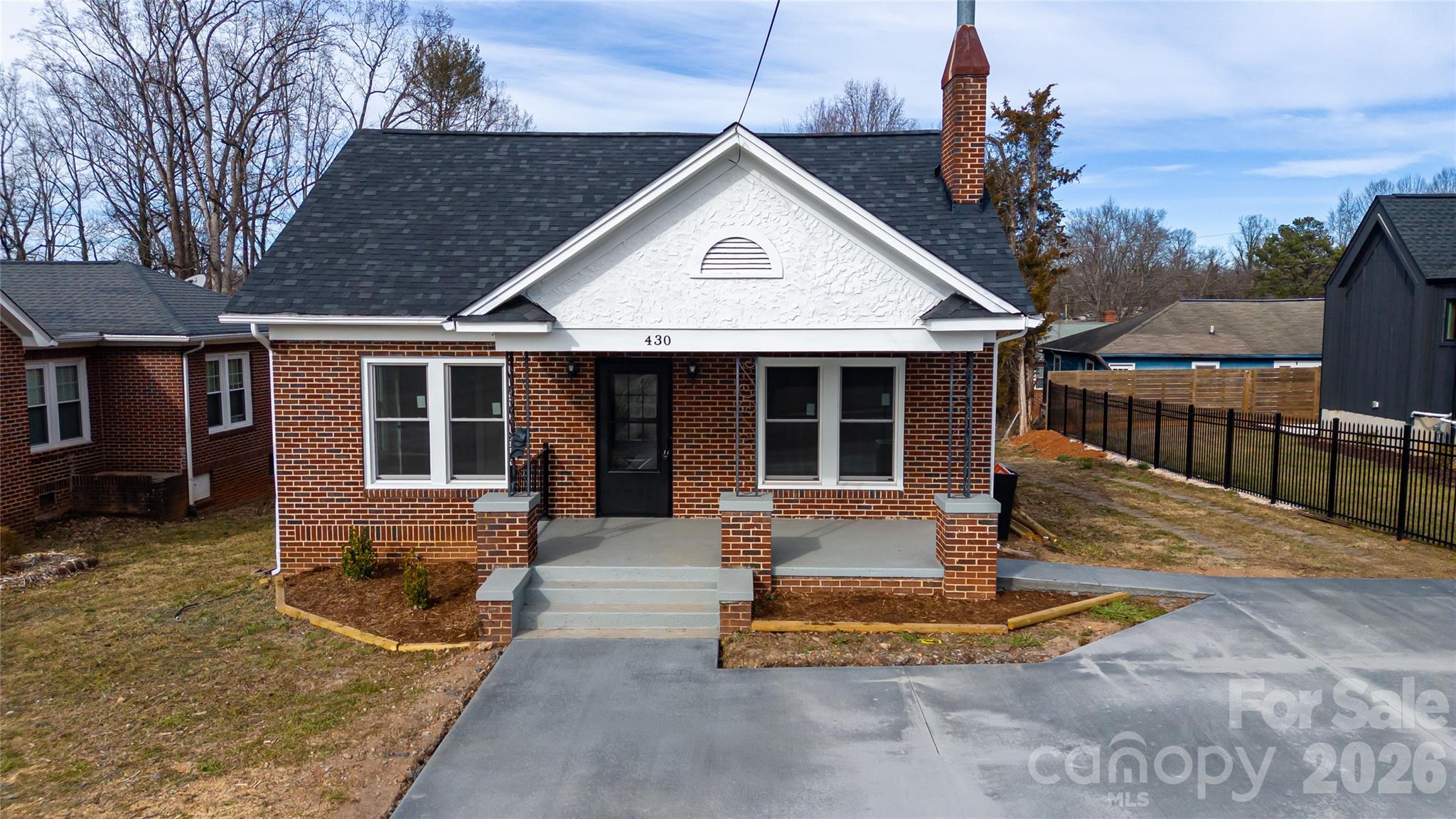 Move right in to this updated 3BR, 1.5Bath brick home within walkin distance to downtown Morganton and steps away from the "fonta flora" trail. This home comes with new architectural shingle roof, new insulated windows, new vanities, new kitchen cabinets w/granite countertops, new stainless steel appliances, refinished hardwood floors in LR, hall & bedrooms and new vinyl plank in kitchen & baths and some updated wiring & plumbing plus enlarged concrete driveway. However, best part will be enjoying morning coffee from the covered front porch. Home also has partial basement for storage or workshop area and good size yard in back for enjoying the outdoors plus only minutes to downtown. Seller is Realtor.