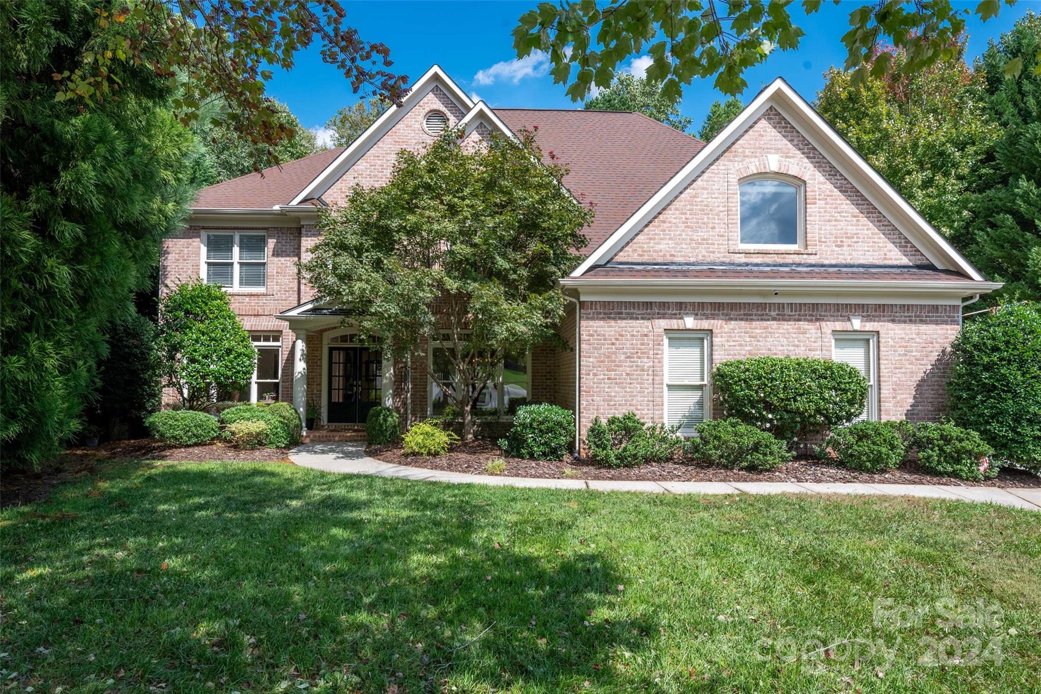 Stately brick front home w/ 3 car garage in sought-after neighborhood w/ resort-style amenities nestled on a wooded cul de sac lot. Backyard features screened porch & built-in stone gas grill for outdoor entertaining. Bright 2 story great room w/ cozy gas fireplace & wooded views. Gourmet kitchen features granite countertops & island w/ gas cooktop.  Recent updates include new carpet, lighting & fresh paint. Primary suite is a peaceful retreat, featuring 2 walk-in closets & spacious bath w/ 2 vanities & garden tub. A bedroom w/ full bath is conveniently located on the main floor, ideal for guests or multigenerational living. 3rd floor bonus room offers plenty of space for game room, media center, or playroom. Access to resort-style amenities including pool, tennis courts, fitness & clubhouse. Premiere location bordering Ballantyne w/ low SC taxes.