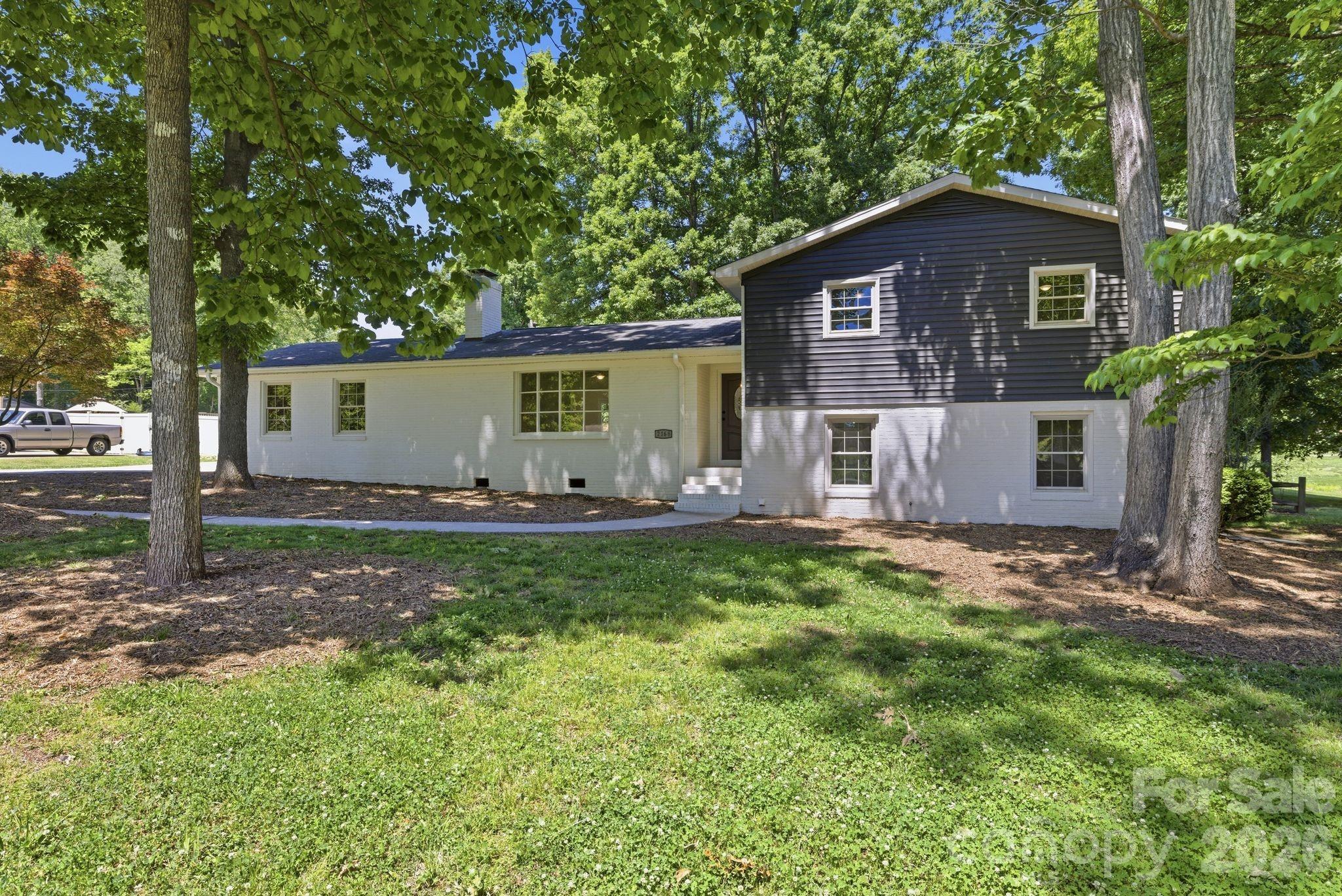Welcome home to this beautifully updated 4 bedroom, 2 bathroom home featuring fresh modern updates, inviting outdoor spaces, and a functional layout designed for everyday living. Tucked among mature trees with a fully fenced backyard, this property offers a great balance of privacy and convenience. Inside, you’ll find fresh paint throughout, brand new LVP flooring, updated bathrooms, and a bright, open feel filled with natural light. The kitchen has been refreshed with quartz countertops, stainless steel appliances, and plenty of cabinet space, creating a clean and modern space that flows nicely into the main living areas. The outdoor living spaces make this home truly stand out. Enjoy the large back deck perfect for entertaining, grilling, or relaxing with family and friends, while the primary bedroom offers private access to its own deck overlooking the backyard. The fenced yard provides plenty of room for pets, play, or gardening with space to truly enjoy the outdoors. Located close to shopping, restaurants, entertainment, and major highways, this move in ready home offers updated finishes, great outdoor space, and a location that makes everyday living easy.