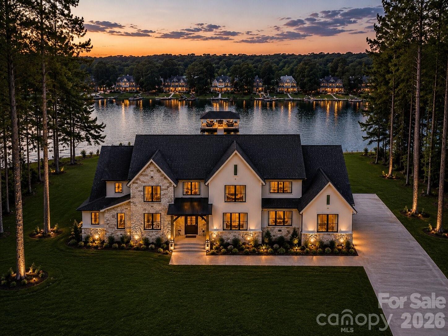 Beautiful Custom Waterfront Home – No HOA!
Exceptional custom home located on a waterfront lot offering quality craftsmanship and designer finishes throughout. The main level features a spacious two-story great room with a stunning two-story fireplace, a gourmet kitchen with high-end appliances, custom cabinetry, and designer-selected finishes. A formal dining room provides an elegant space for entertaining. The primary suite and a custom office are also located on the main level for added convenience. Upstairs includes two bedrooms with water views, a large loft area, and a cozy reading nook on the stair landing overlooks the lake, creating the perfect spot to relax and unwind. The basement features and additional bedroom and full bath with water views, flex room and large family room with wet bar.  Outdoor living features covered and uncovered porches, a patio, and a private boat dock for enjoying lakefront living at its best. A three-car garage provides ample parking and storage. This home showcases premium materials and attention to detail throughout—too many quality features to list.