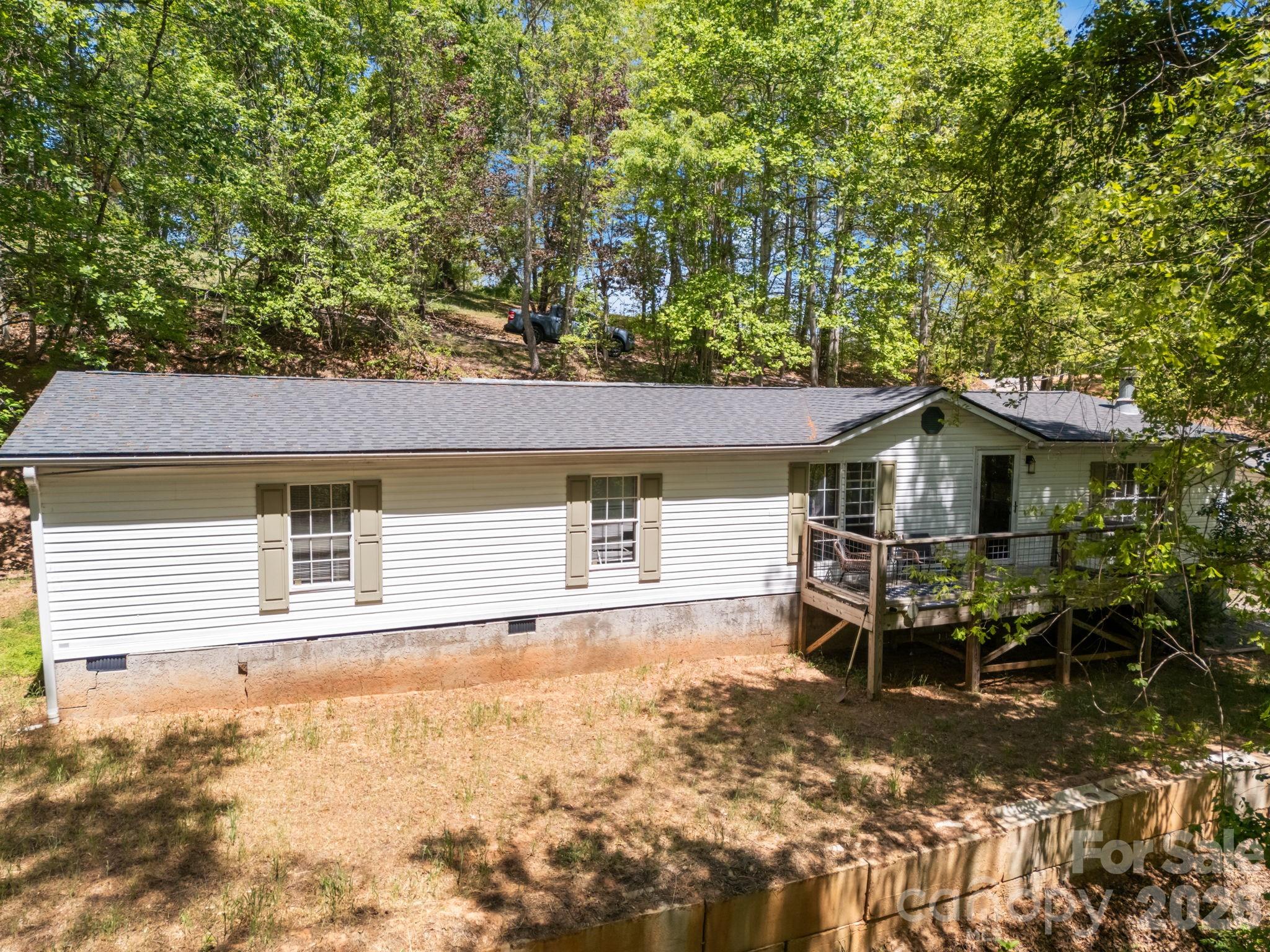 Tucked away in the heart of Black Mountain, this charming 3-bedroom, 2-bath doublewide offers the kind of easy mountain living that just feels right from the moment you pull in.Step onto the front deck, take a breath of that crisp mountain air, and you’ll immediately understand what makes this place special. Out back, a covered porch creates the perfect space for slow mornings, evening gatherings, or just unwinding after a long day.Inside, the home offers a comfortable and functional layout with plenty of room to spread out, whether you’re settling in full-time or looking for a weekend retreatLocation is where this one really shines—just moments from Lake Tomahawk, a local favorite known for its scenic walking trail, mountain views, and community feel . And when you’re ready to grab dinner, coffee, or enjoy everything this town has to offer, you’re only minutes to downtown Black Mountain, one of Western North Carolina’s most loved small-town destinations.Whether you’re looking for a primary home, investment, or mountain getaway, this one checks all the boxes.