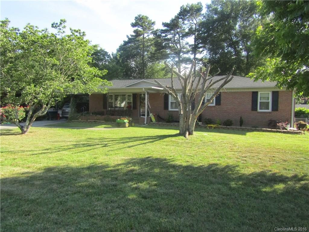 A spacious 3 Bedroom / 2 Bathroom; Ranch Style House located on a Level Landscaped Lot.  Some trees encircle the House.   It has a Single Attached Carport with an 24 x 26 Single Detached Garage that can be used as a Workshop.