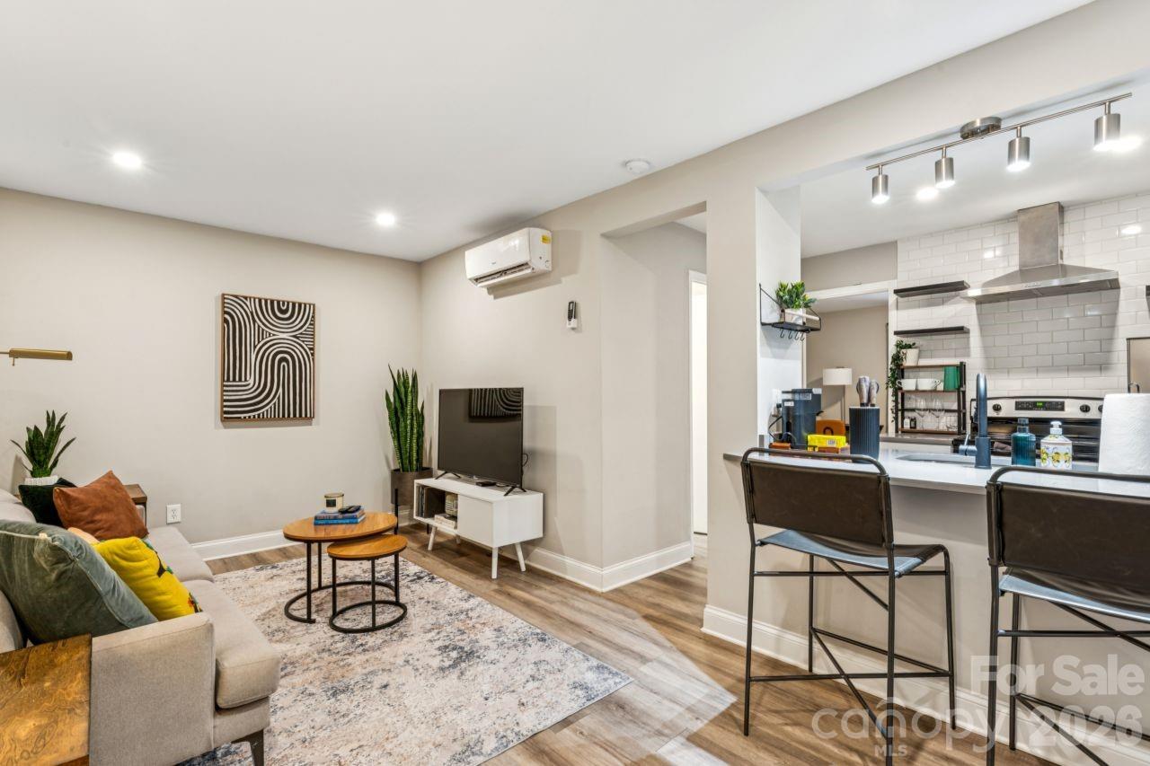 Fully renovated one-bedroom condominium featuring a modern kitchen with quartz countertops, subway tile backsplash, stainless steel appliances, and a breakfast bar ideal for casual dining. The spacious bedroom offers two generous closets, while the updated bathroom includes a tiled tub/shower surround. Luxury vinyl plank flooring runs throughout, and an in-unit washer and dryer are included for added convenience.

NoDa Landing Condominiums is a gated community with a charming courtyard setting, grilling area, ample outdoor seating, and recreation space. Community amenities include a fenced dog park, fitness center, and abundant open parking. The unit also conveys with two storage units, a rare and valuable feature.

The HOA provides high-speed internet, valet trash service, maintenance of common areas, recreation spaces, and the dog park. Ideally located with easy access to Uptown Charlotte, NoDa, Optimist Hall, and Plaza Midwood, this property offers both modern comfort and exceptional convenience.

Back on market due to buyer financing falling through because of lender project approval requirements related to ownership concentration within the community. No fault of the seller.
