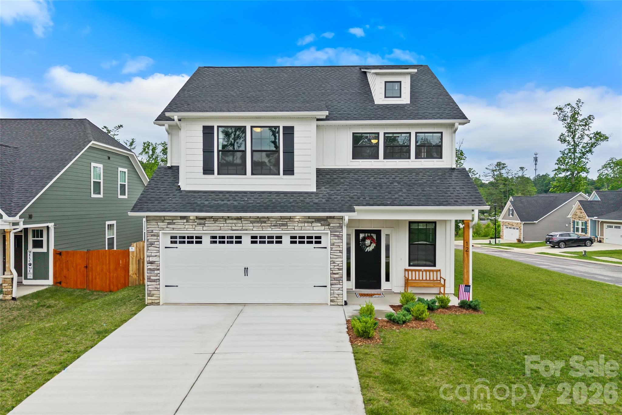 The Authors community puts you right in the sweet spot minutes from both Asheville and Hendersonville. This is the kind of neighborhood kids can grow up in and parents actually love living in.
Main-level living, zero-entry living keeps daily life easy, and the open-concept great room flows right into the kitchen and dining area under soaring 9-foot ceilings, plenty of room to cook, gather, and just be together. The primary suite is tucked away on the main level with a large walk-in closet, tile shower, and double vanities.
Upstairs, everyone gets their space. Two more bedrooms, a full bath, a generous flex room, AND a dedicated office or craft room — perfect for homework, hobbies, or a guest retreat.
Outside, the fenced backyard is ready for pets, play, and slow evenings on the patio. The corner lot gives you extra side yard and the privacy to actually use it.
Connected living. Room to breathe. Come see it.