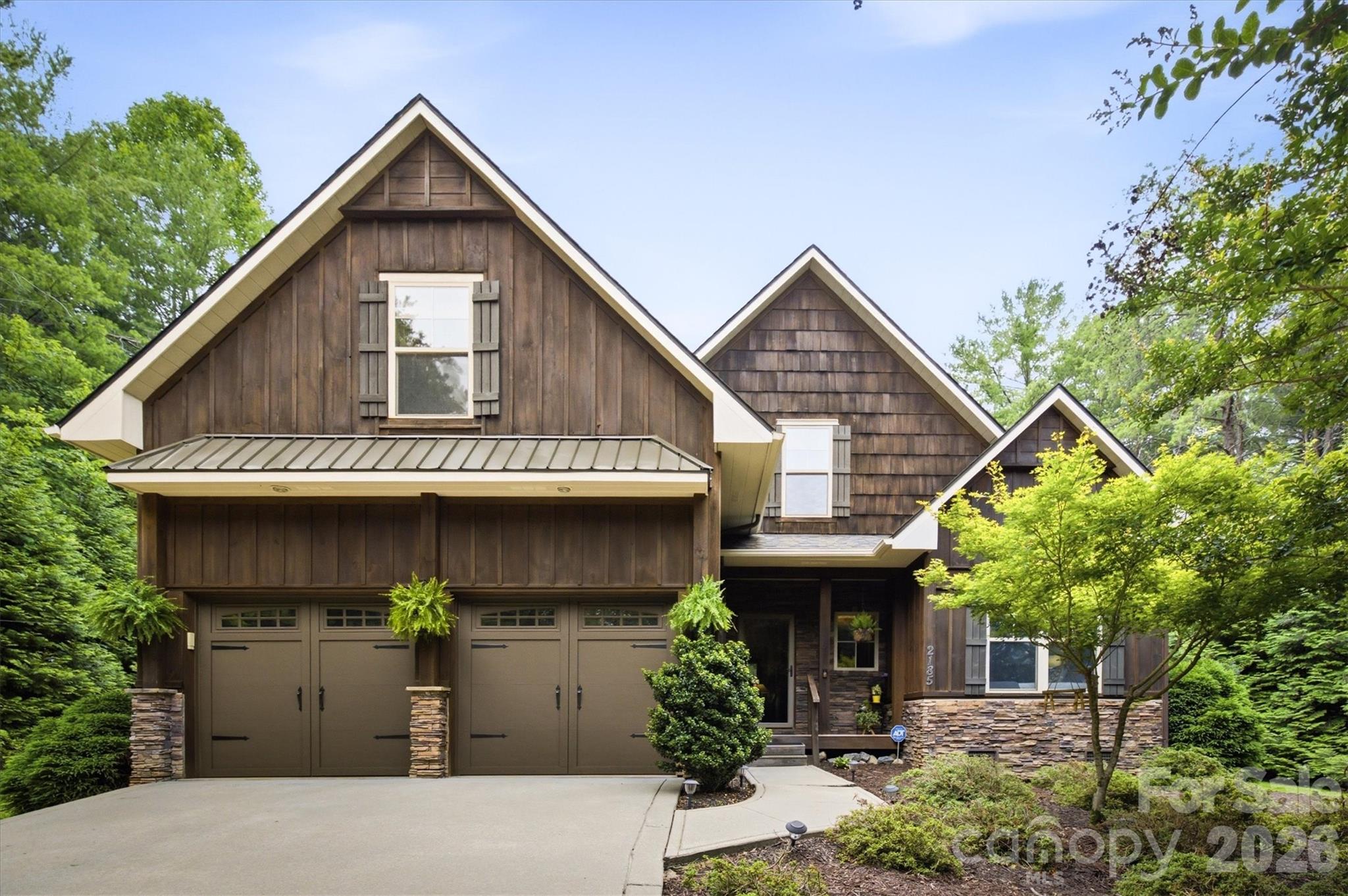You don't want to miss this one-of-a-kind custom-built home in Burke County's best-kept secret, beautiful Cottage Park at Lake James! This exclusive, high-end gated community offers lake access from Mimosa Marina, conveniently located just across the street, along with the benefit of no city taxes. Situated on a private 1.07-acre lot, this exceptional home offers 4 bedrooms, 3 full baths, an all-weather room, and a spacious bonus room. As an added bonus, the new owner will enjoy use of a boat slip at Mimosa Marina for the remainder of 2026, plus the peace of mind of a one-year paid home warranty. Step inside to discover beautiful real hardwood floors and solid wood doors throughout. The open-concept living room, dining area, and kitchen are accented by soaring cathedral ceilings and a stunning rock fireplace, creating the perfect space for entertaining or relaxing. The kitchen features granite countertops, a closet pantry, abundant cabinetry, and newer stainless steel appliances.
The main level offers two bedrooms and two full baths, including a spacious primary suite with a tray ceiling, walk-in closet, and luxurious ensuite featuring a custom tiled walk-in shower, Jacuzzi soaking tub, and dual granite vanity. A conveniently located laundry room with additional storage completes the main floor. One of the home's standout features is the light-filled all-weather room overlooking the private backyard. Complete with a second fireplace, it's the perfect place to unwind year-round. Upstairs you'll find two generously sized bedrooms, a full bath, and a large bonus room ideal for a media room, home office, playroom, or guest space. Outdoor living is just as impressive with decks on both sides of the home, both replaced within the last three years. The property also includes a powered storage building, providing plenty of room for hobbies, lawn equipment, or workshop space. Residents of Cottage Park enjoy outstanding community amenities including an HOA-maintained in-ground pool, clubhouse, and convenient boat and trailer storage. Whether you're searching for a full-time residence or the perfect Lake James retreat, this custom home offers the ideal blend of luxury, privacy, and lake lifestyle.