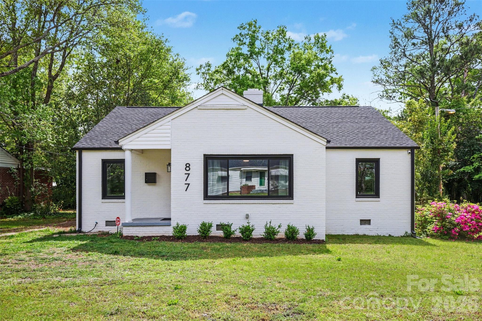 Welcome to this beautifully updated home just minutes from downtown Rock Hill, where modern upgrades, artistic design, and move-in-ready convenience come together. From the moment you arrive, the painted full brick exterior, black-framed windows, and refreshed landscaping create standout curb appeal with a clean, modern look. Step inside to a warm, curated interior filled with character. Previously an artist’s home, the space features unique design elements—including a custom faux stone accent wall that creates an eye-catching focal point and sets the tone for the rest of the home. The large picture window brings tons of light into the large living space accented with a gas fireplace. Flowing into the spacious dining area with a cozy window seat offering added storage. The renovated kitchen (2026) blends style and function with modern cabinetry, butcher block countertops, undermount sink, and stainless steel appliances—perfect for both everyday living and entertaining. The updated bathroom and fresh interior paint throughout create a clean, cohesive feel. A thoughtfully redesigned laundry space includes updated plumbing and a full-size stackable washer & dryer, maximizing efficiency without sacrificing convenience. Step outside to enjoy a private backyard retreat featuring a newly built shed for storage or workspace and a firepit area—ideal for relaxing evenings or hosting friends. This property offers true peace of mind with extensive renovations that were done for the home-owner including: ROOF & GUTTERS (2024), HVAC SYSTEM + DUCTWORK (2023), WINDOWS (2024), WATER HEATER (2023), ALL NEW ELECTRICAL WIRING & PANEL (2023), PLUS CPI SECURITY SYSTEM installed for peace of mind. Ideally located just minutes from Rock Hill’s vibrant downtown, you’ll enjoy easy access to local dining, shopping, parks, and entertainment—while still having the comfort of a quiet residential setting. If you’re looking for a fully updated, character-filled home with major systems already replaced—this one is a must-see.  THIS PROPERTY QUALIFIES FOR SC HOUSING LOW RATE AND DOWN PAYMENT ASSISTANCE PROGRAMS (UPTO $10K IN ASSISTANCE OR AROUND 1% OFF RATE). WE ARE ALSO OFFERING A LENDER PAID 1%: 1YR RATE BUY DOWN WITH PREFERRED LENDER.