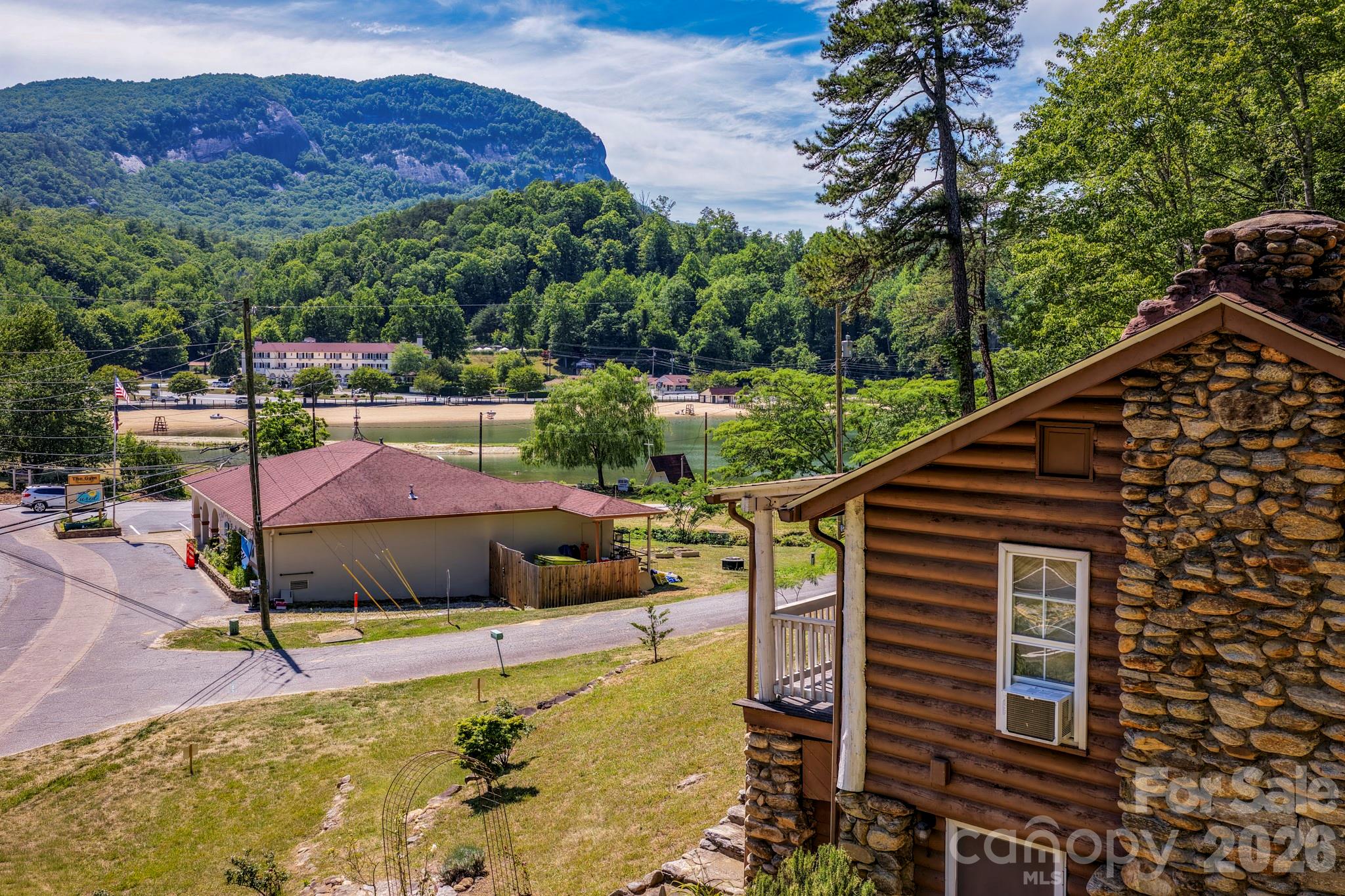 SPECTACULAR VIEWS OF CHIMNEY ROCK MOUNTAIN AND THE LAKE LURE BEACH AREA! 2 bedroom, 1 1/2 bath, 740 sq ft, Sears & Robuck, primitive, log cabin dating back to the 1920's....before the lake existed. his historic little gem is in amazing condition and is a short walk to the lake's edge and Lake Lure each. Has all the conveniences of home and is affordably priced at $300,000. A great weekend getaway or short term rental opportunity.