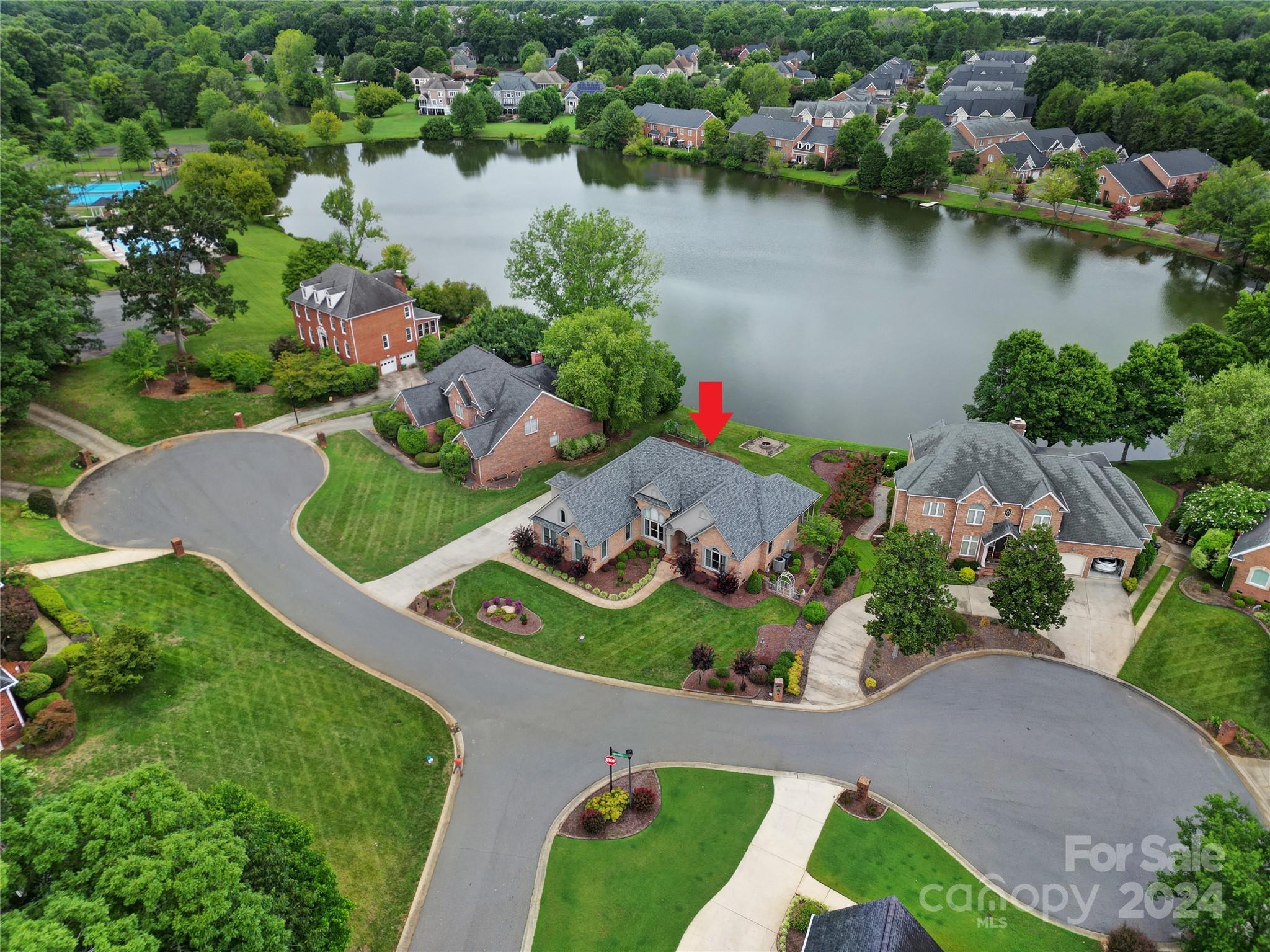 Prepare to fall in love with this luxurious waterfront home in amenity rich Beacon Knoll! This brick beauty has been meticulously maintained by its original owners. Recent updates include kitchen, master bath, roof, Pella series 400 windows, 19 seer HVAC, 2” garage door, too many updates to list! Dual Master Suites!!  Spacious main level master features wow factor & breathtaking water views. Private upper level master with an abundance of storage. Open floorplan with soaring ceilings & an abundance of natural light. Gas fireplace, extensive molding, site finished hardwoods, lush lawn, professionally landscaped, full irrigation, large Eze-Breeze porch with hot tub, concrete patio with retractable awning & paver patio with fire pit. Amenities include clubhouse, inground pool, tennis/paddleboard courts, basketball court, playground, community dock/kayak launch.  Feel like you are on vacation year-round while just minutes from shopping & I-77.  Fort Mill Schools! Hurry this one won’t last.